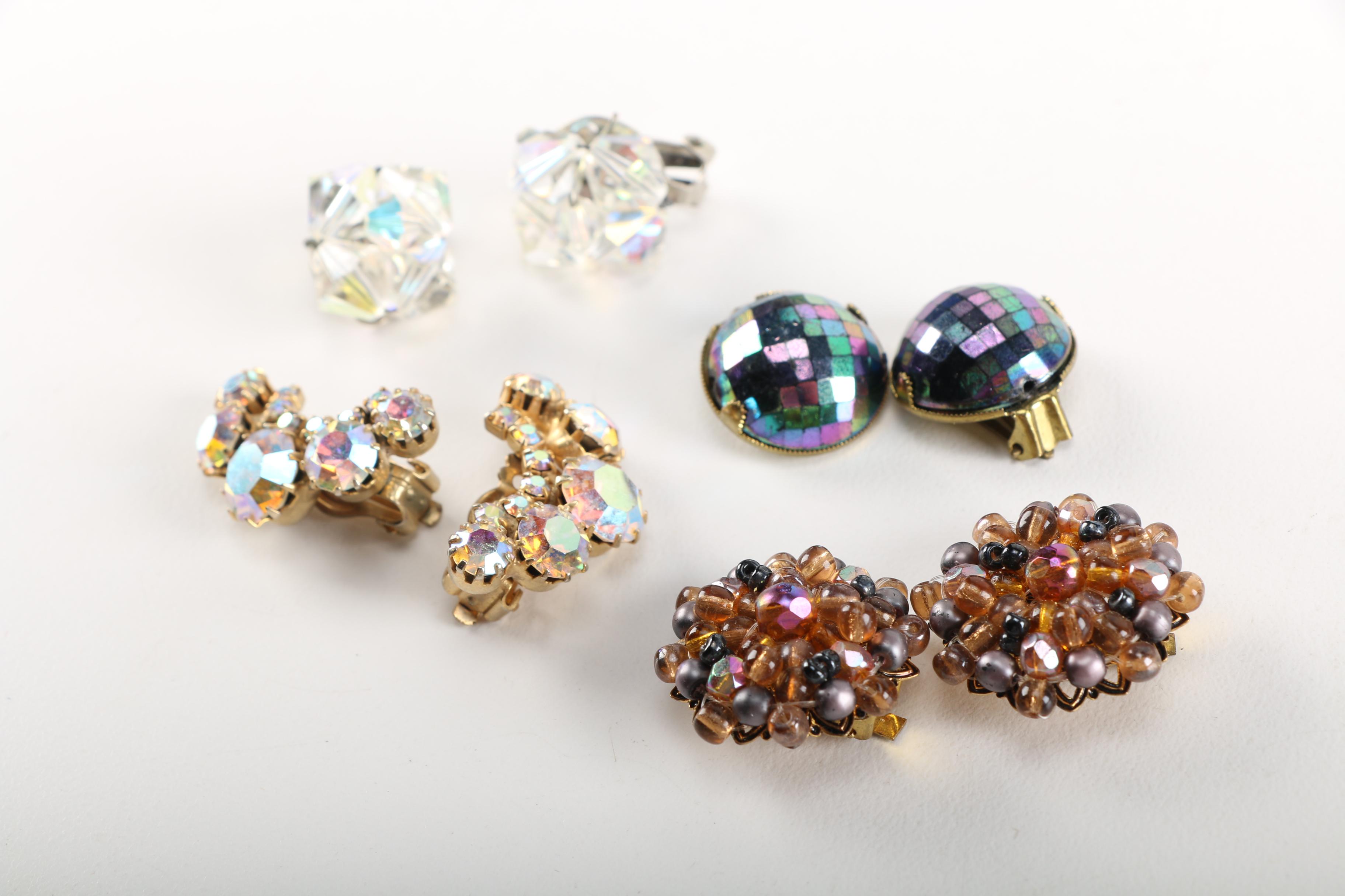 Assortment of Earrings Featuring a Pair Belt Buckles