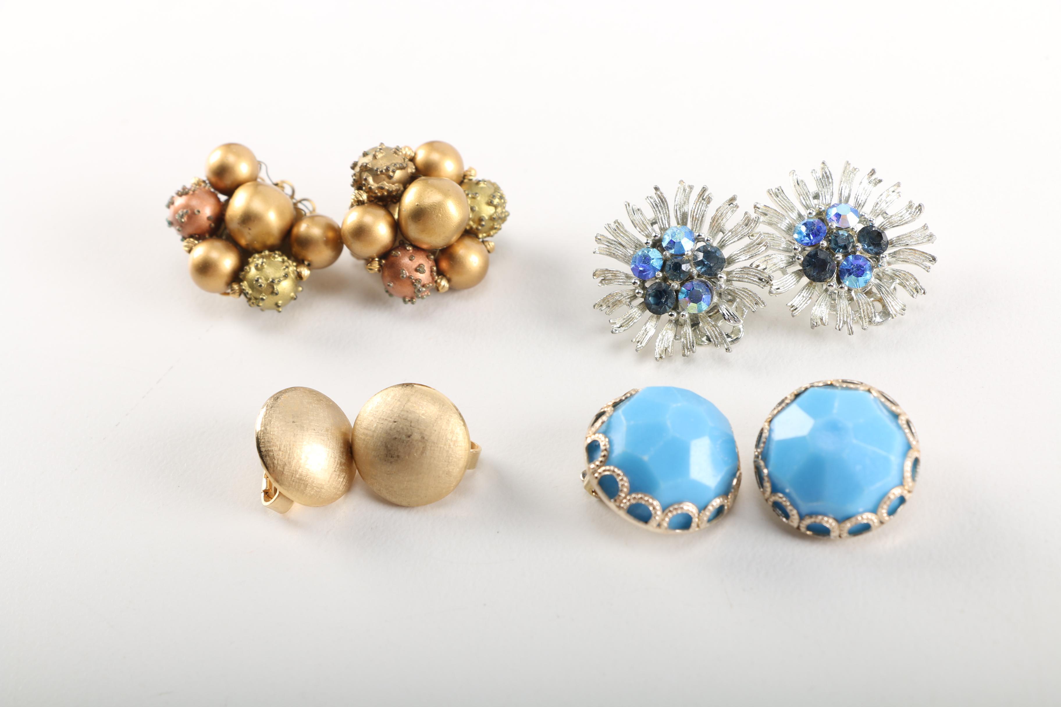 Assortment of Earrings Featuring a Pair Belt Buckles