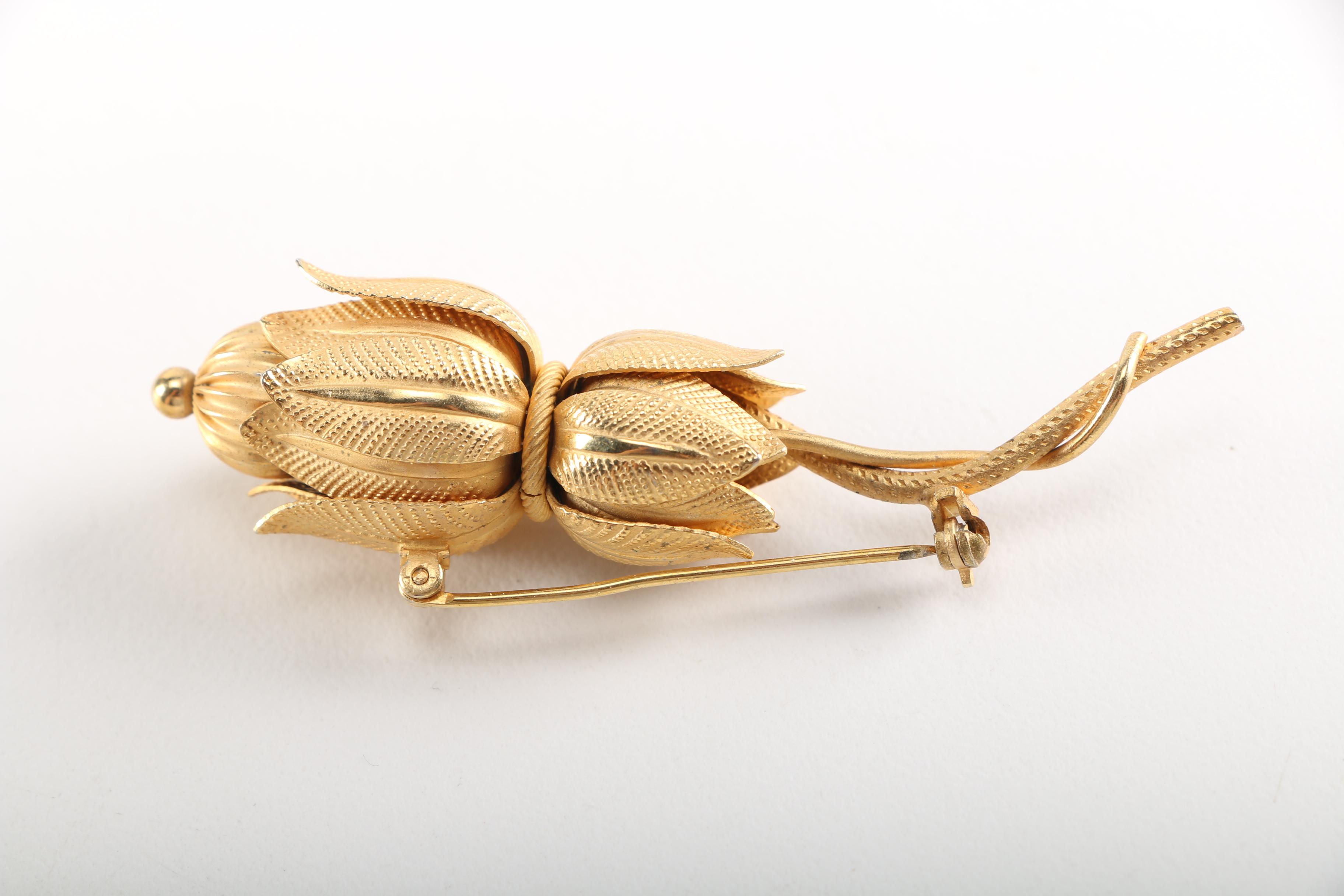 Assortment of Earrings Featuring a Pair Belt Buckles