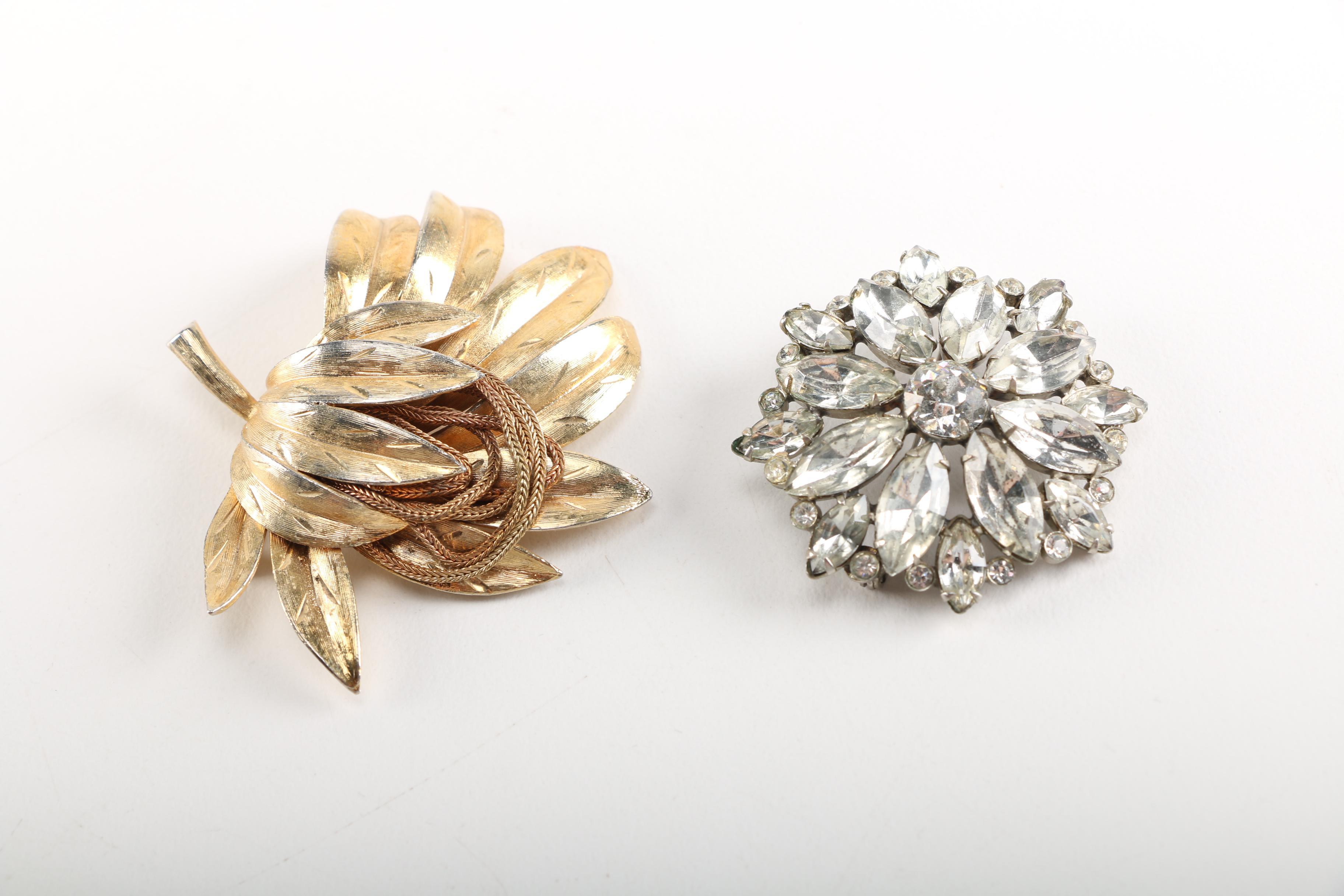 Assortment of Earrings Featuring a Pair Belt Buckles