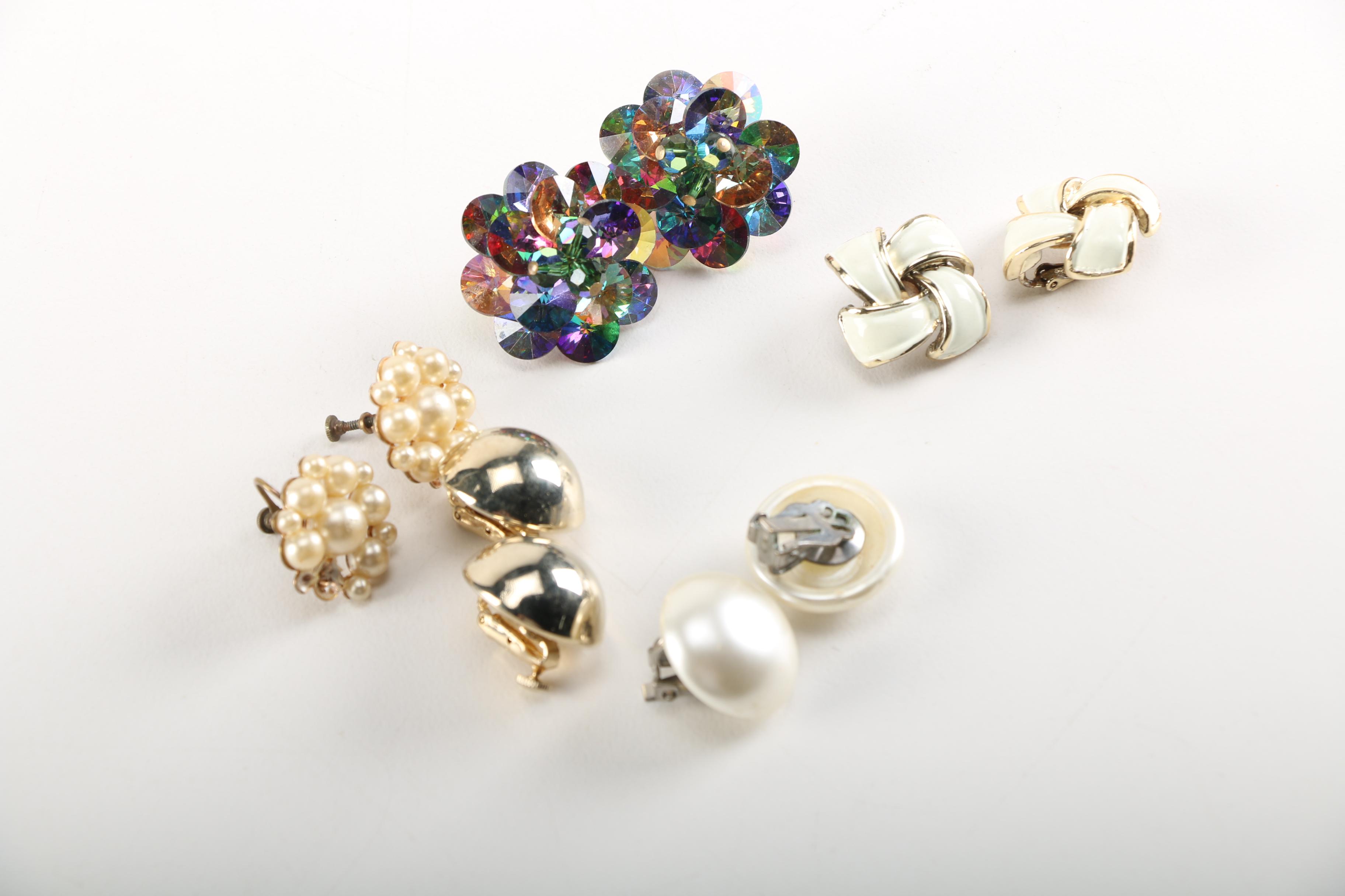 Assortment of Earrings Featuring a Pair Belt Buckles