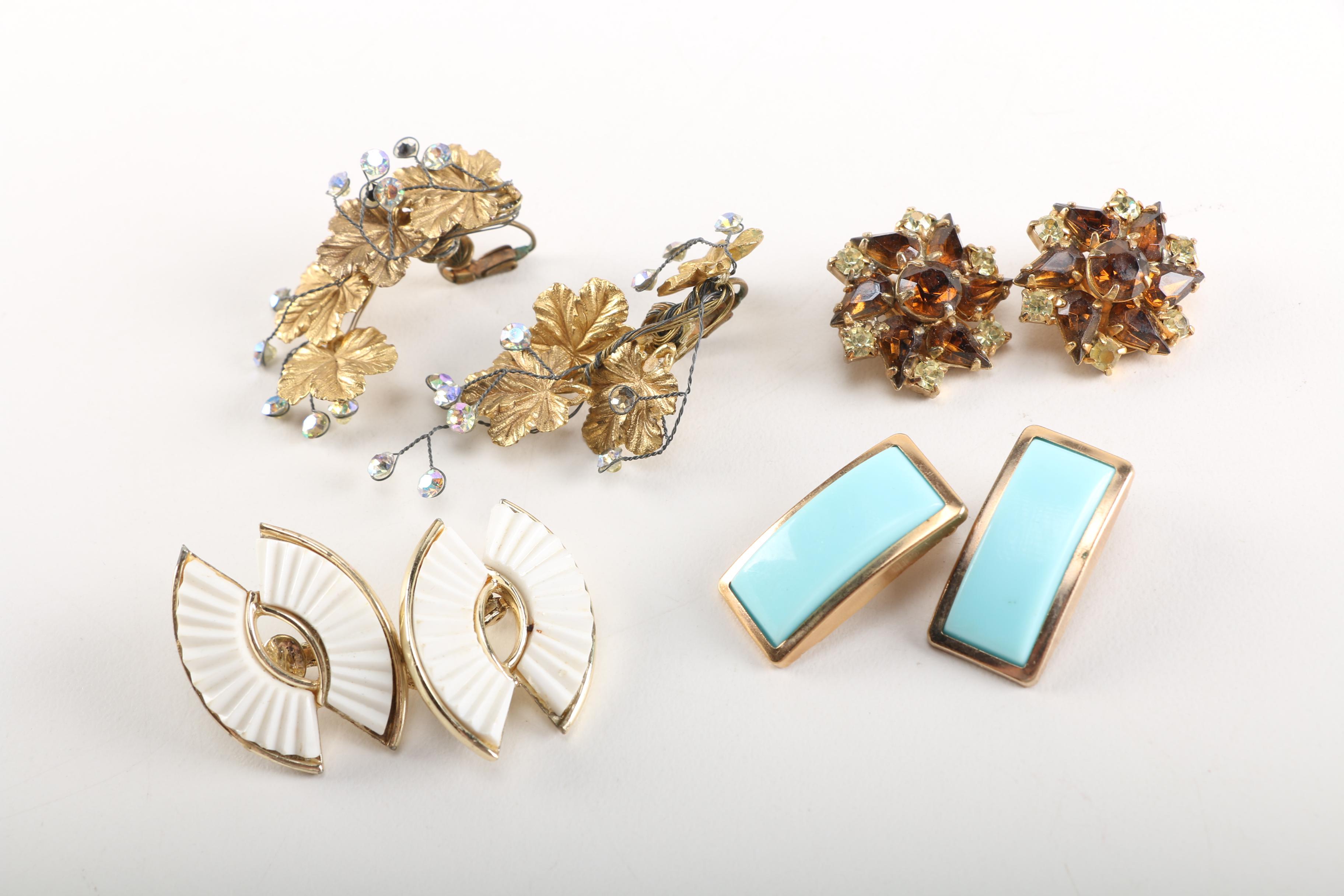 Assortment of Earrings Featuring a Pair Belt Buckles