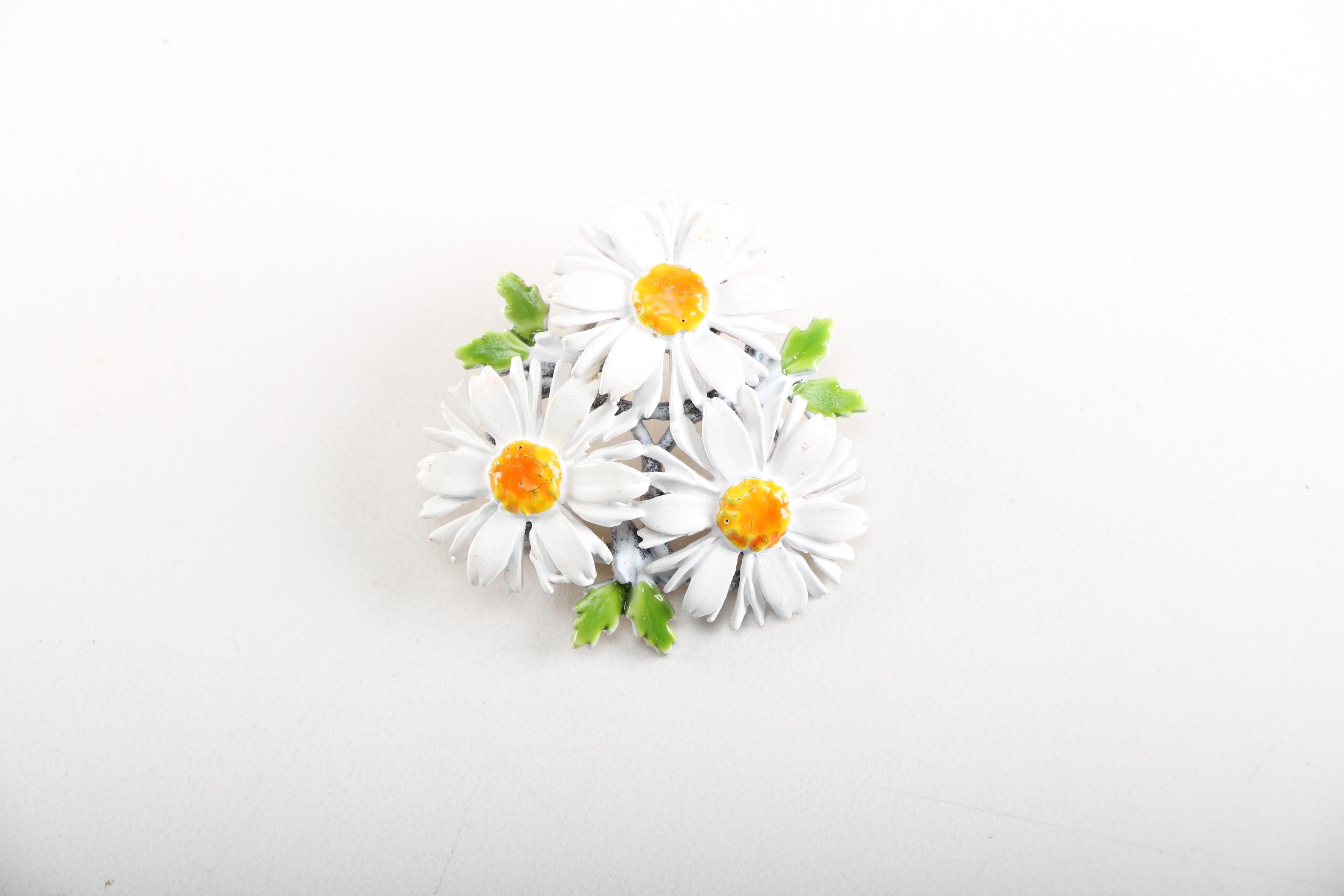 Assortment of Earrings Featuring a Pair Belt Buckles