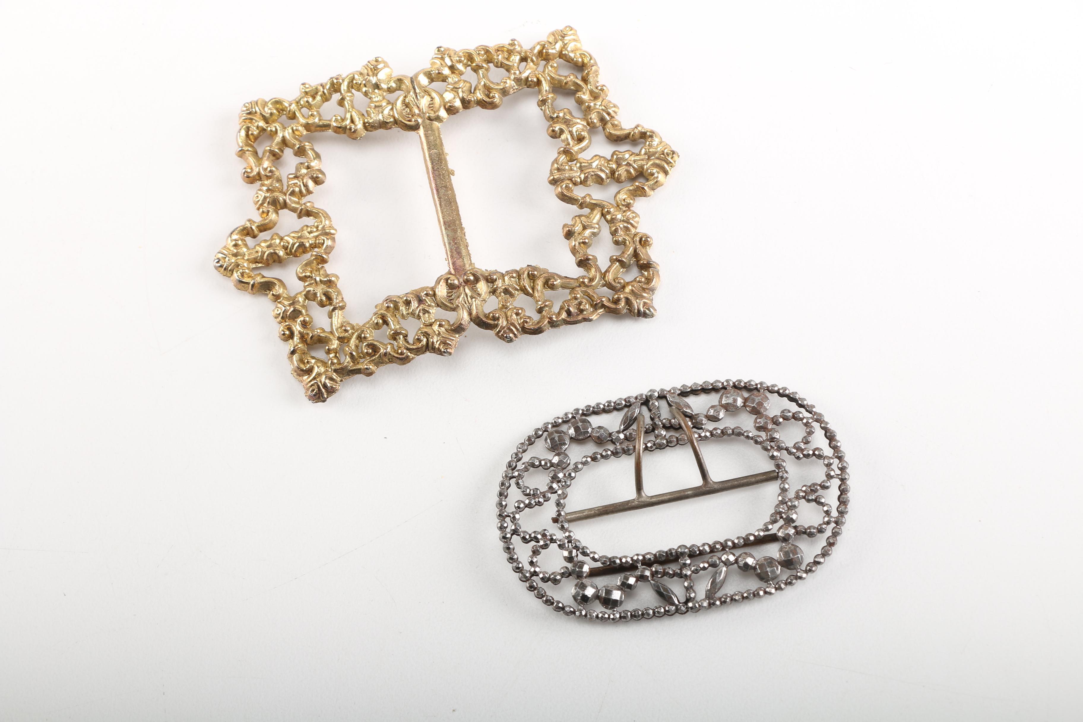 Assortment of Earrings Featuring a Pair Belt Buckles