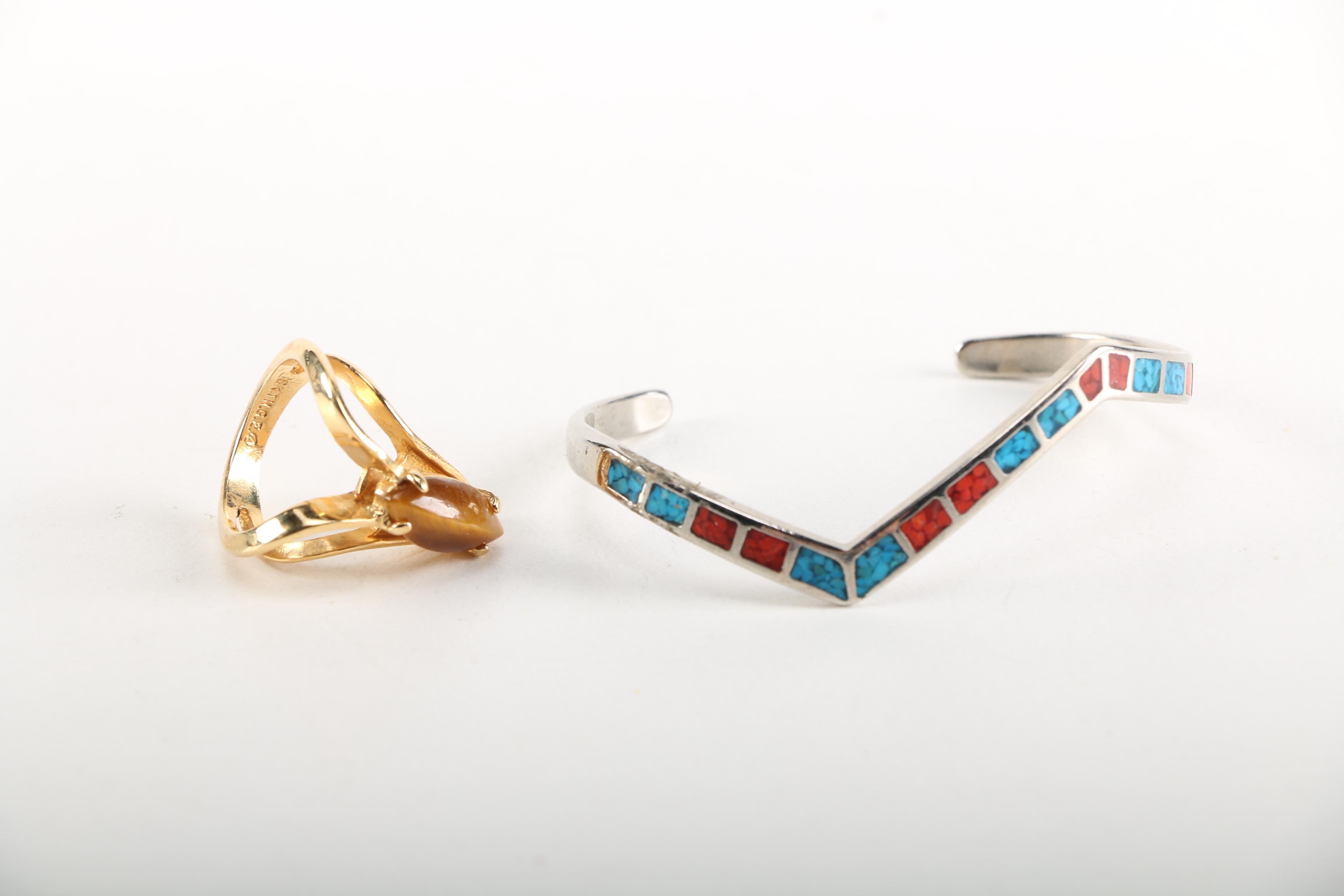 Assortment of Earrings Featuring a Pair Belt Buckles