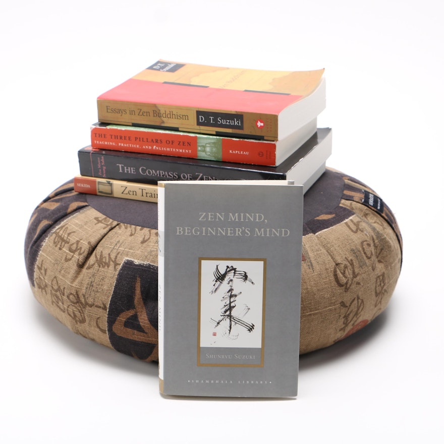 Meditation Pillow With a Collection of Books on Zen Philosophy