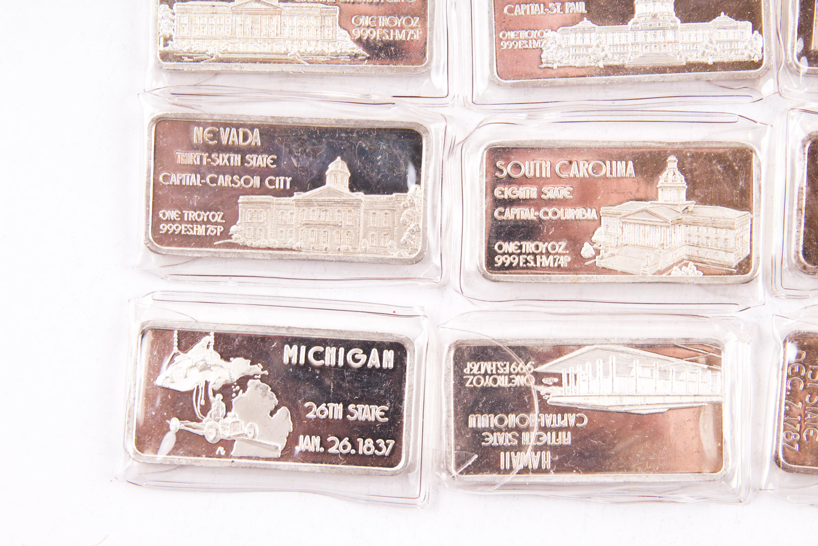 Large Grouping of Hamilton Mint State Themed One Troy Ounce .999 Silver Ingots