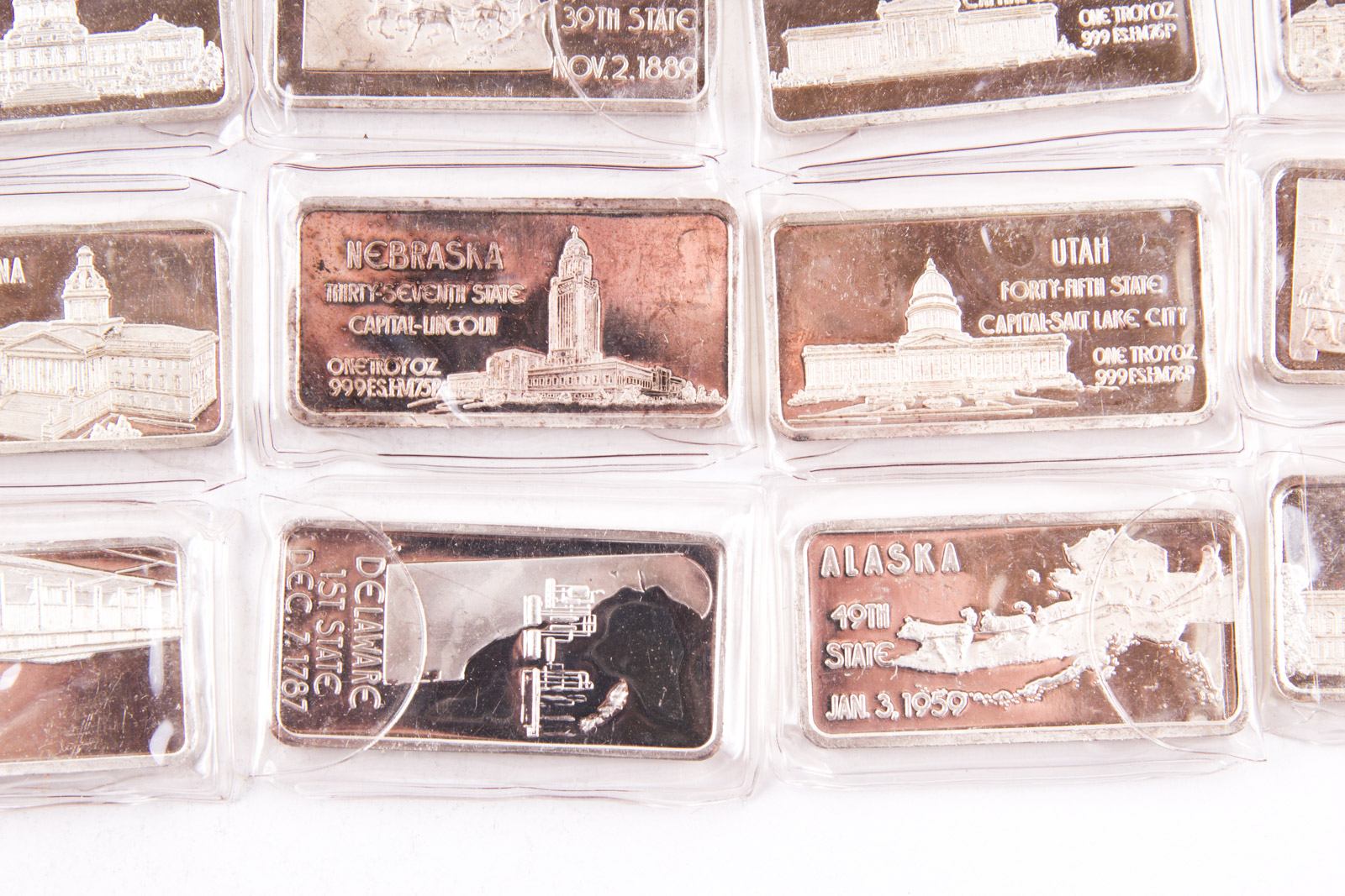 Large Grouping of Hamilton Mint State Themed One Troy Ounce .999 Silver Ingots