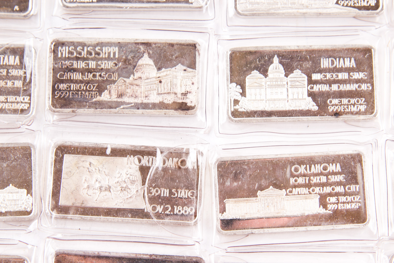 Large Grouping of Hamilton Mint State Themed One Troy Ounce .999 Silver Ingots