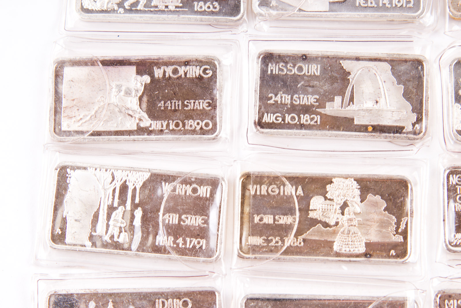 Large Grouping of Hamilton Mint State Themed One Troy Ounce .999 Silver Ingots