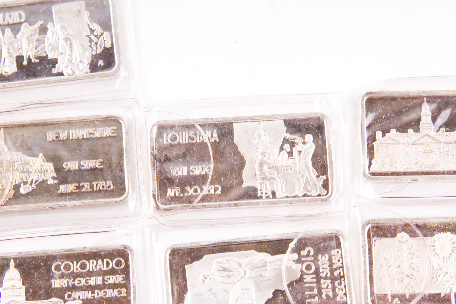 Large Grouping of Hamilton Mint State Themed One Troy Ounce .999 Silver Ingots