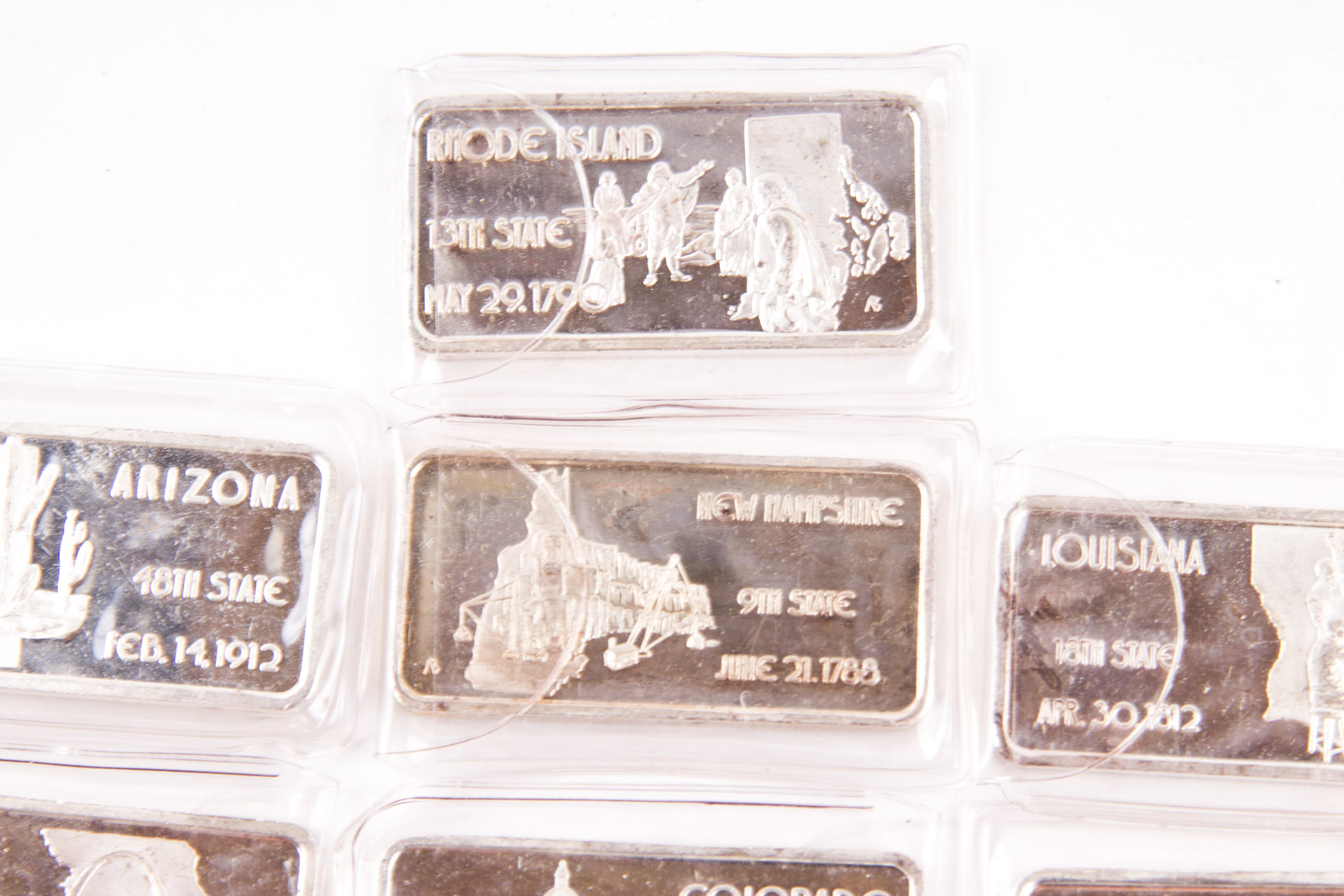 Large Grouping of Hamilton Mint State Themed One Troy Ounce .999 Silver Ingots