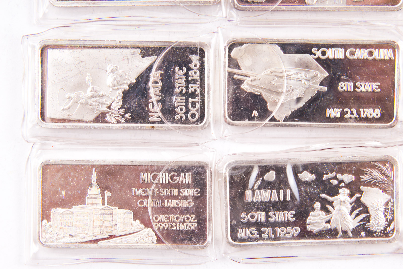 Large Grouping of Hamilton Mint State Themed One Troy Ounce .999 Silver Ingots