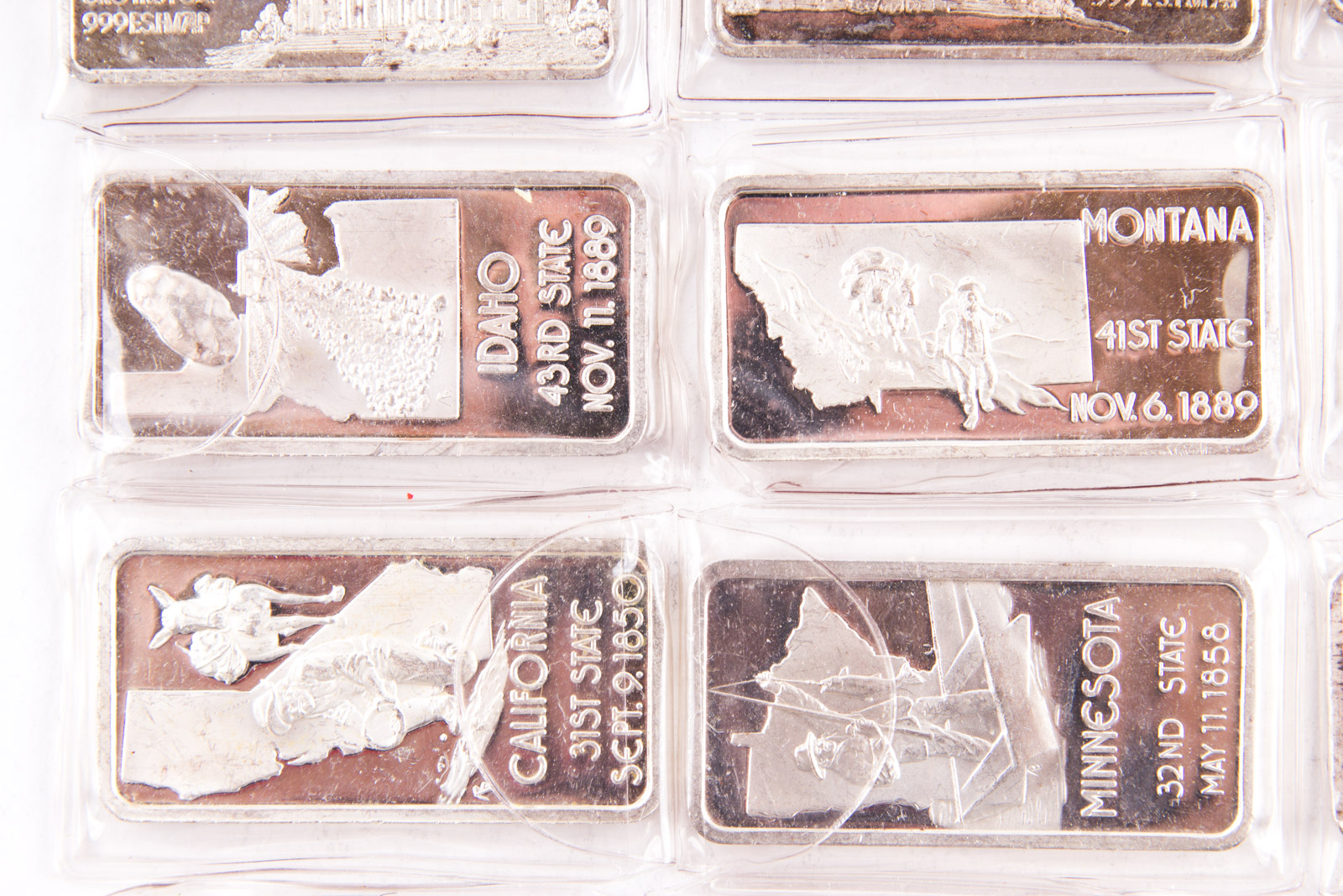 Large Grouping of Hamilton Mint State Themed One Troy Ounce .999 Silver Ingots