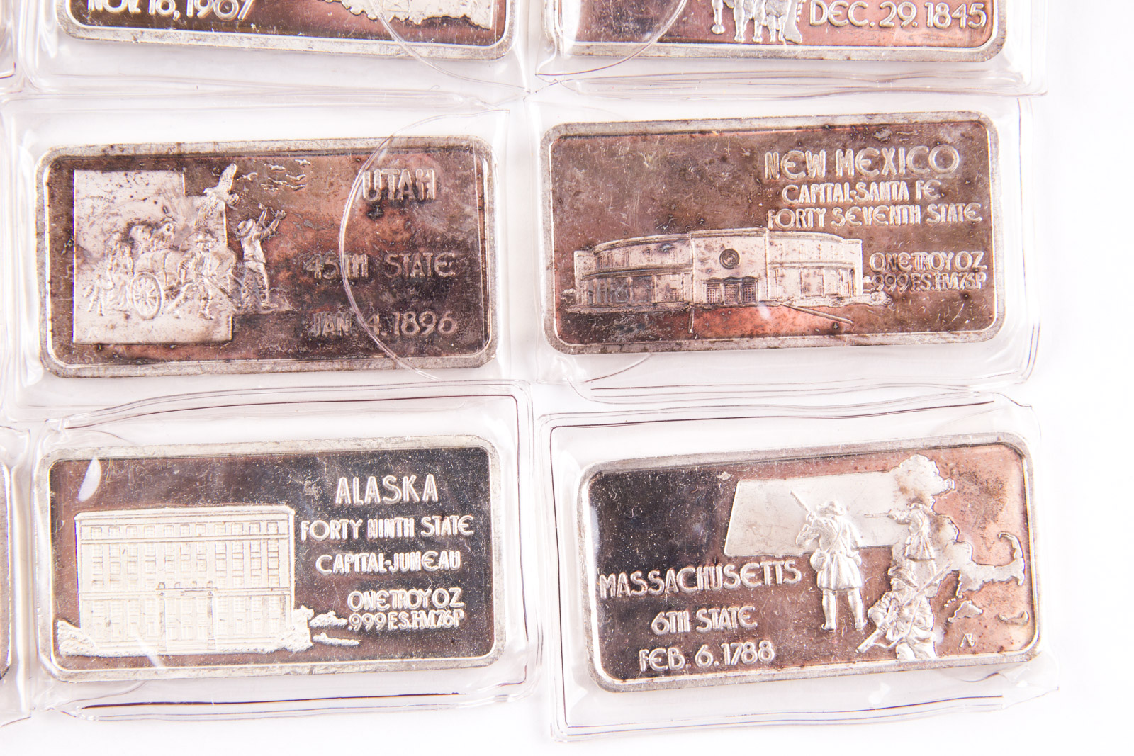 Large Grouping of Hamilton Mint State Themed One Troy Ounce .999 Silver Ingots