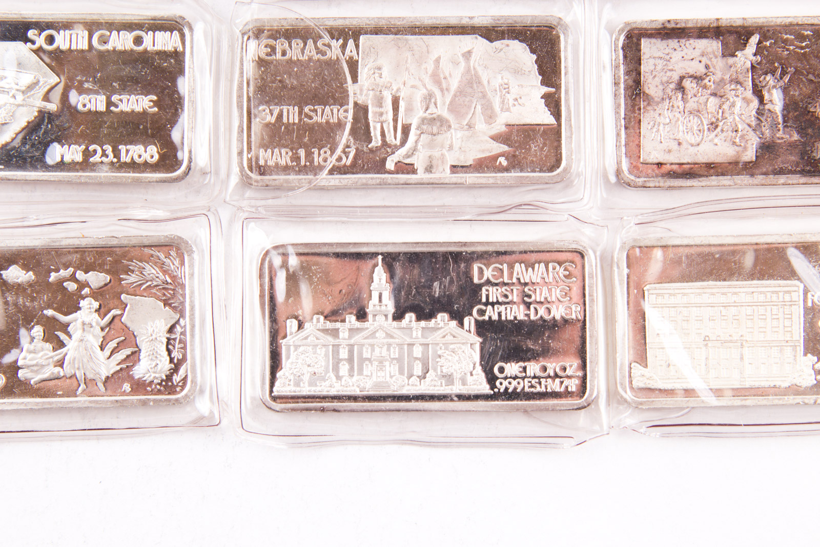 Large Grouping of Hamilton Mint State Themed One Troy Ounce .999 Silver Ingots