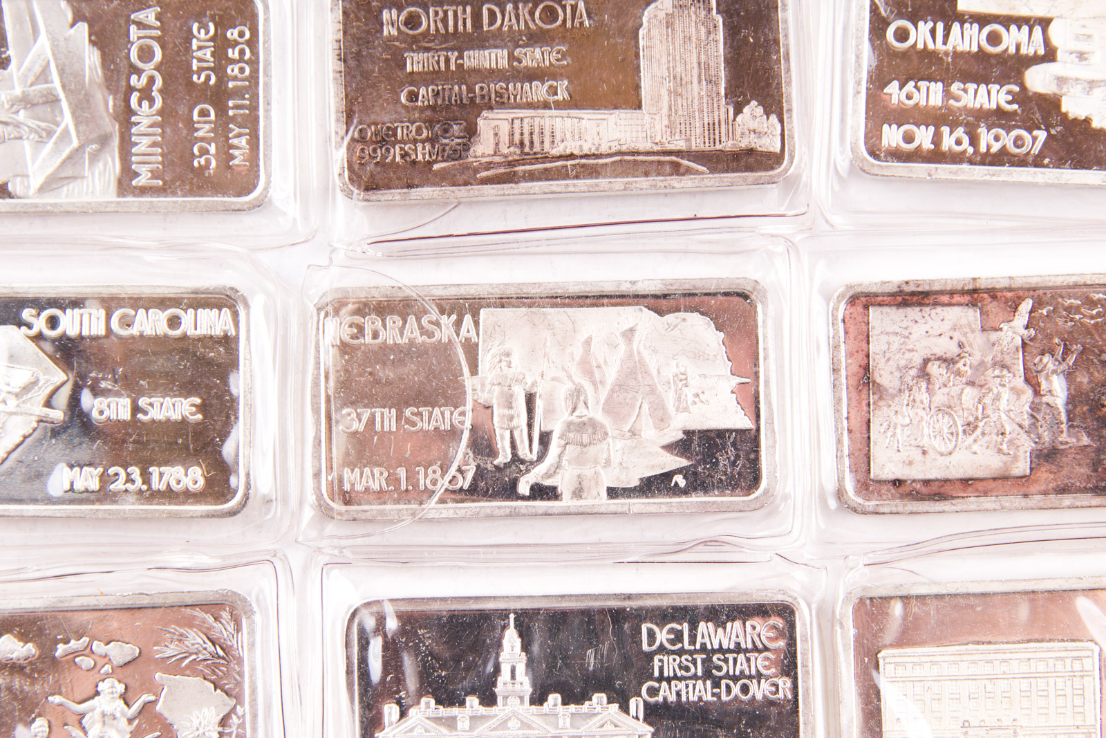 Large Grouping of Hamilton Mint State Themed One Troy Ounce .999 Silver Ingots