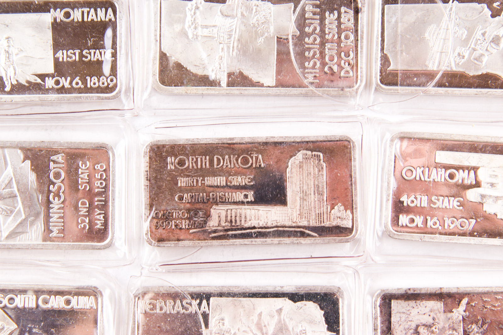 Large Grouping of Hamilton Mint State Themed One Troy Ounce .999 Silver Ingots