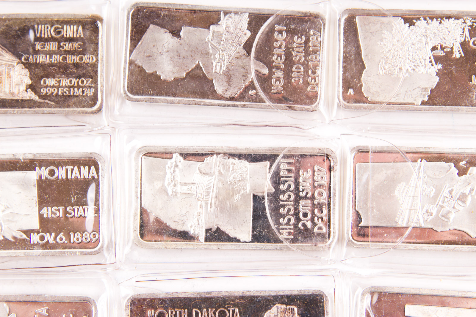 Large Grouping of Hamilton Mint State Themed One Troy Ounce .999 Silver Ingots