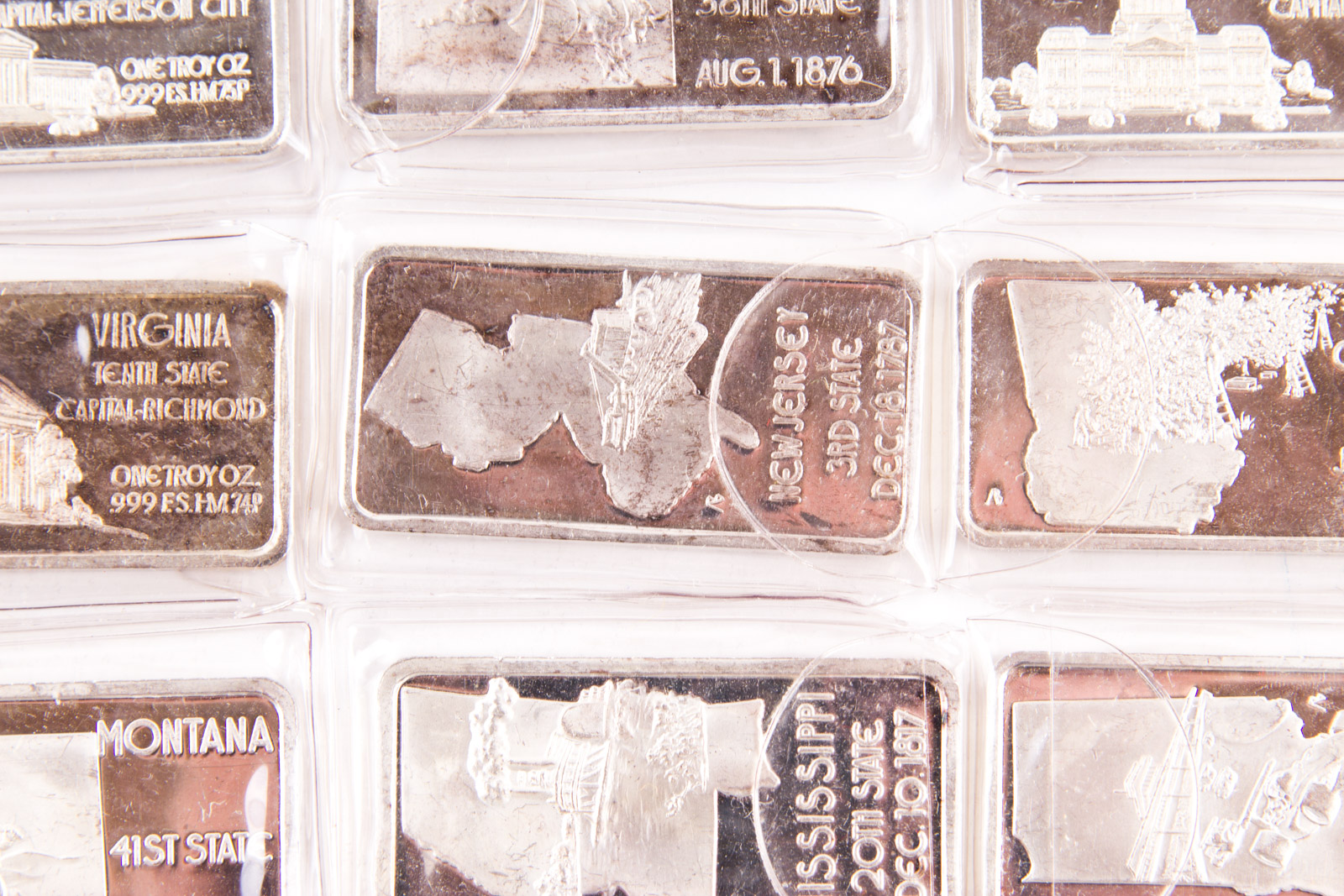 Large Grouping of Hamilton Mint State Themed One Troy Ounce .999 Silver Ingots