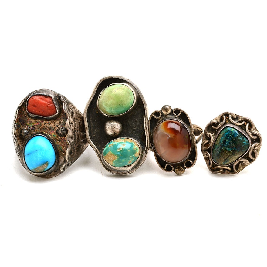 Four Sterling Rings Featuring Turquoise, Coral and Fire Agate