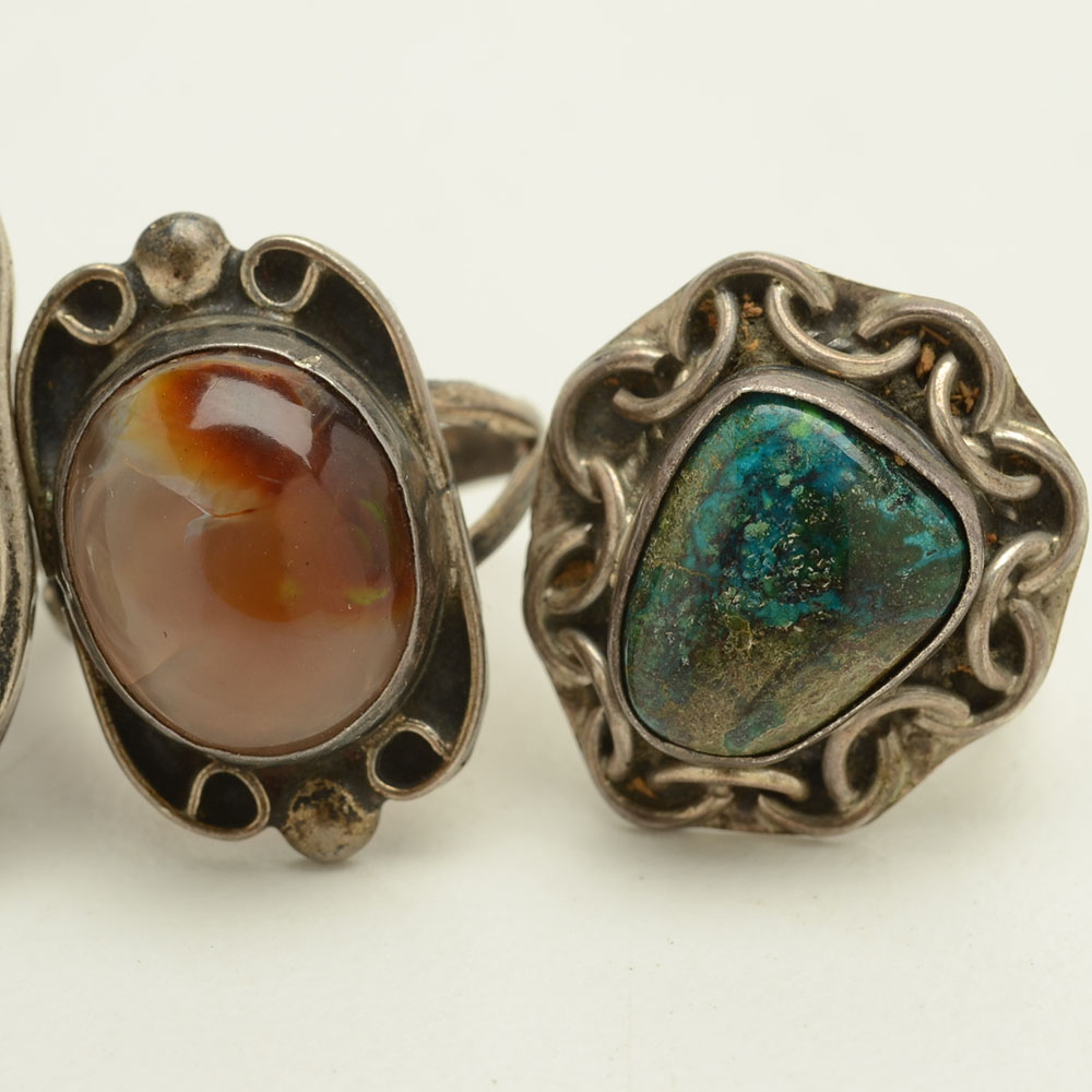 Four Sterling Rings Featuring Turquoise, Coral and Fire Agate