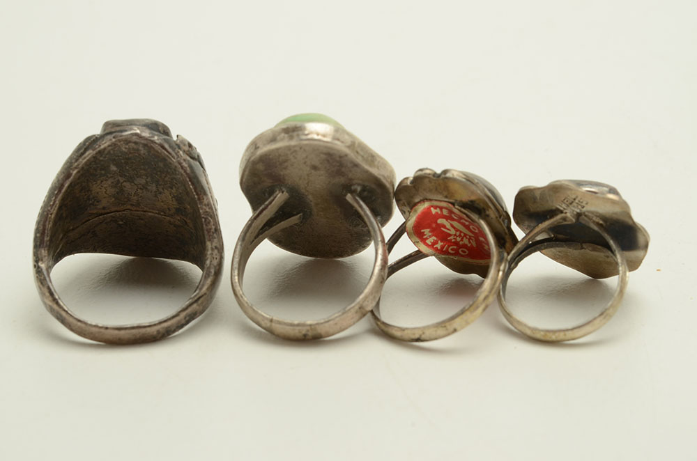 Four Sterling Rings Featuring Turquoise, Coral and Fire Agate