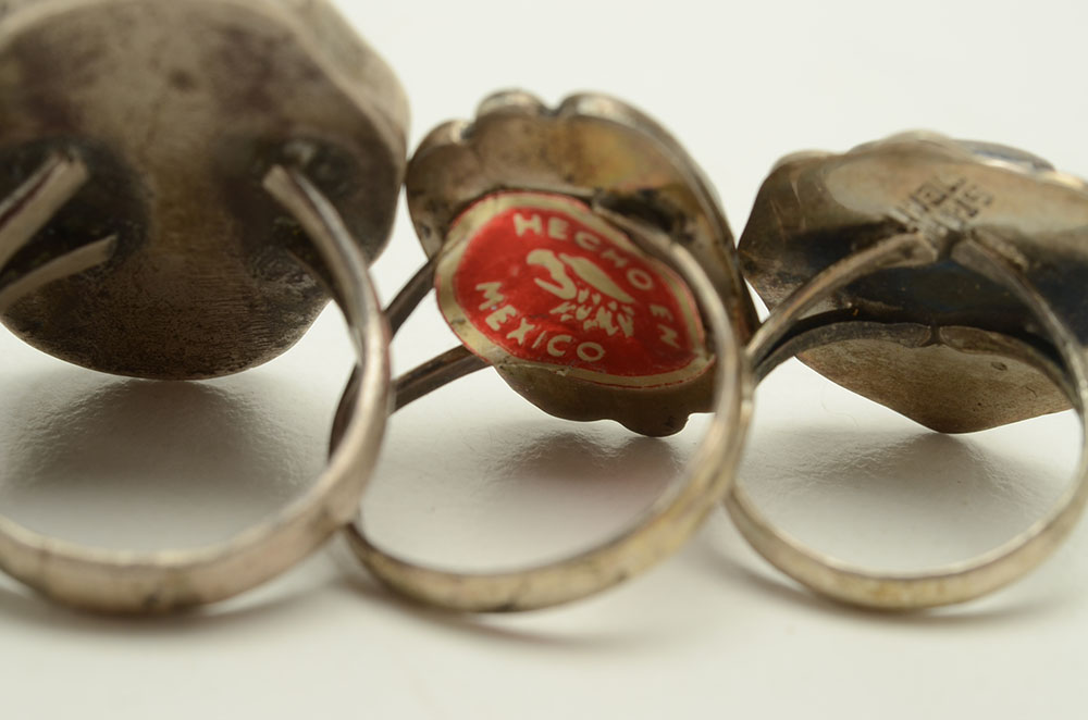 Four Sterling Rings Featuring Turquoise, Coral and Fire Agate