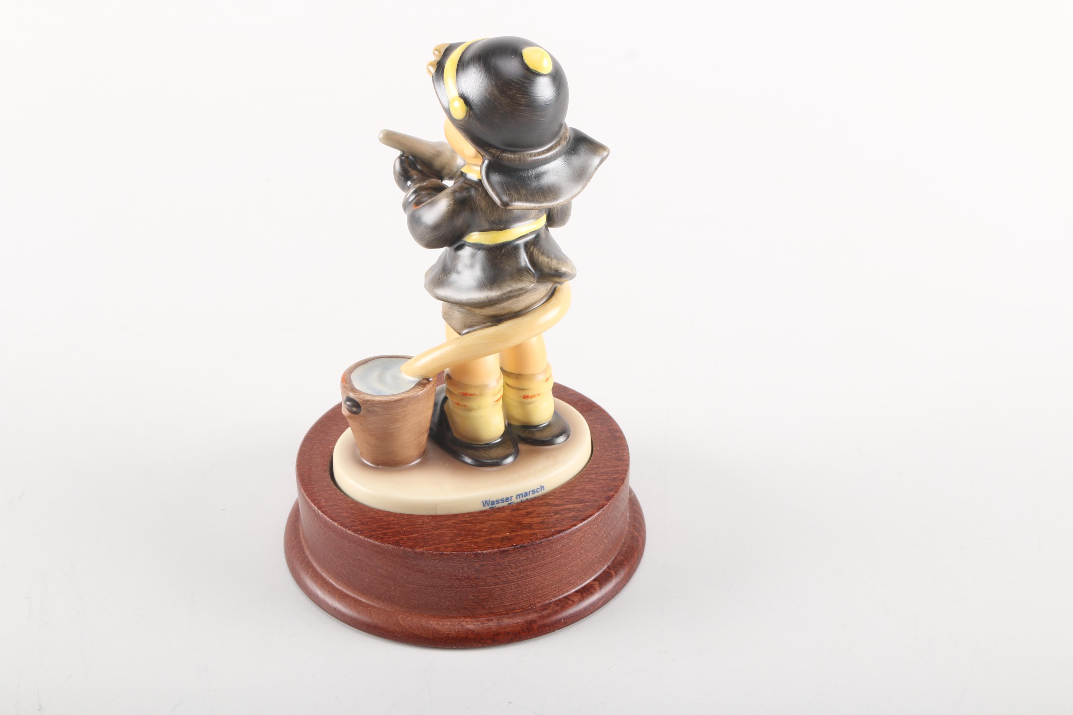 2000 Limited Edition Hummel "Fire Fighter" Ceramic Figurine and "American Heroes" Stand