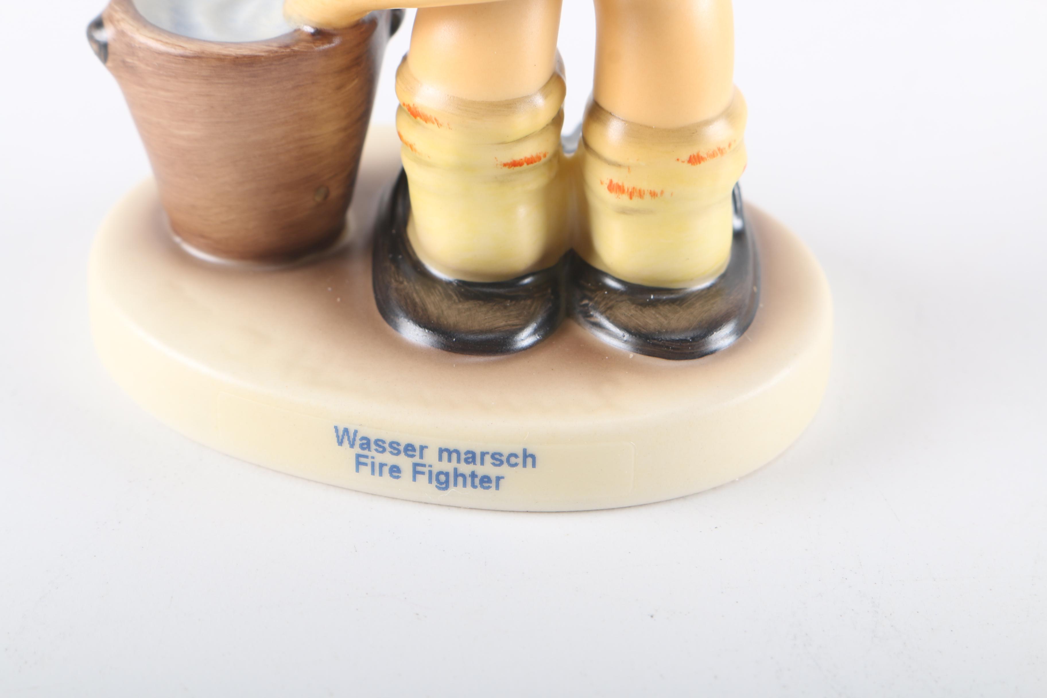 2000 Limited Edition Hummel "Fire Fighter" Ceramic Figurine and "American Heroes" Stand