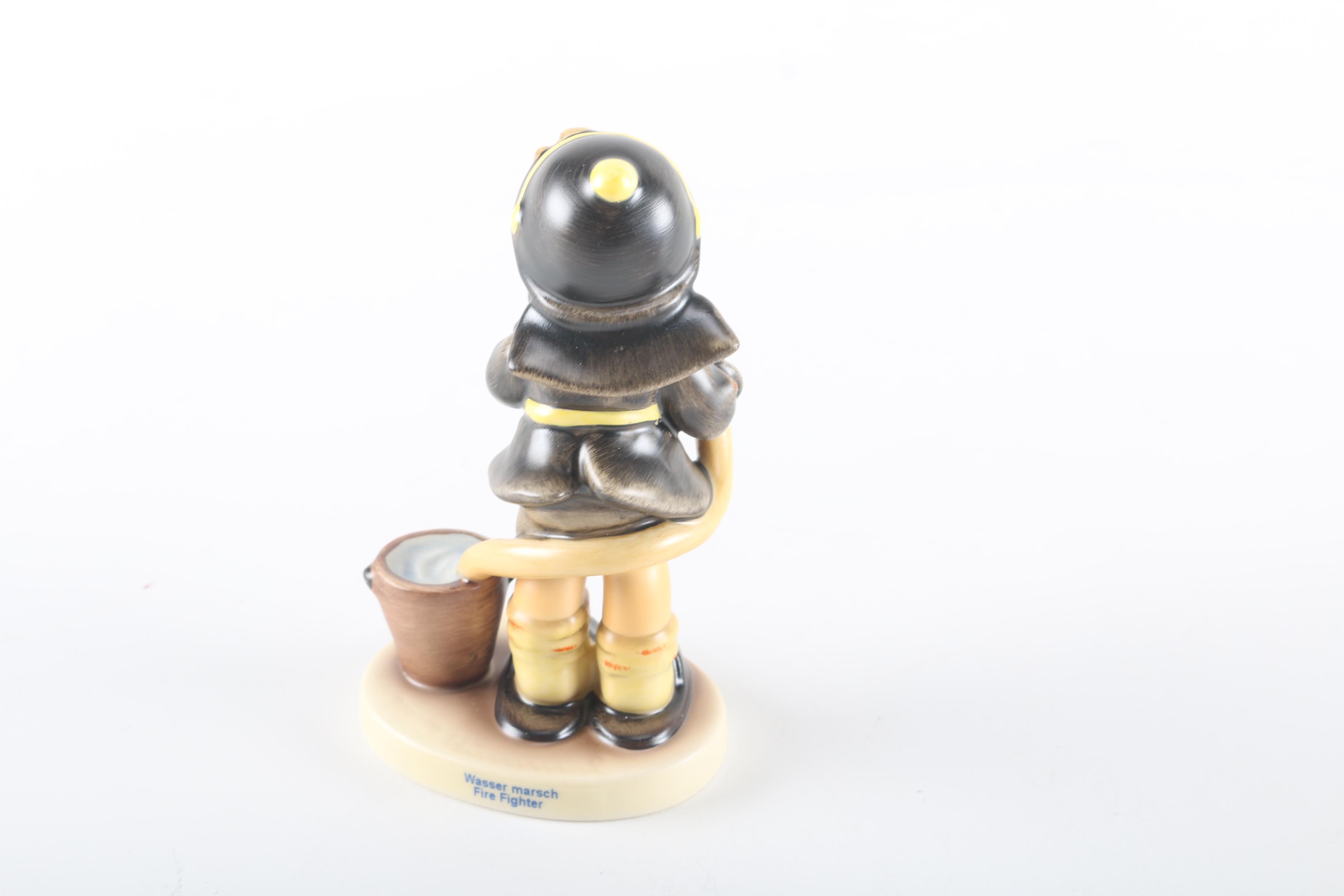 2000 Limited Edition Hummel "Fire Fighter" Ceramic Figurine and "American Heroes" Stand