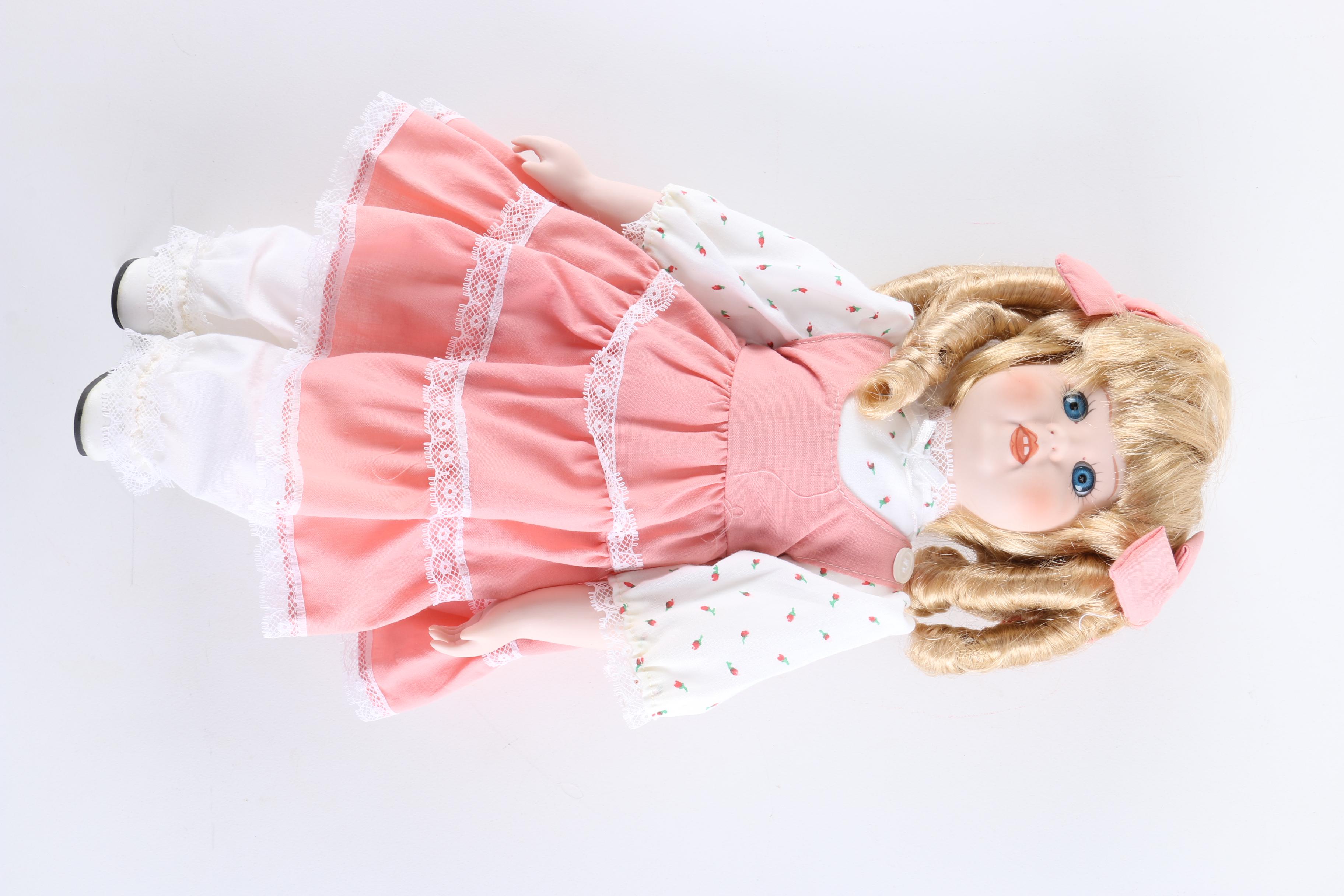 Porcelain Dolls Including a Dynasty Doll with Matching Bear