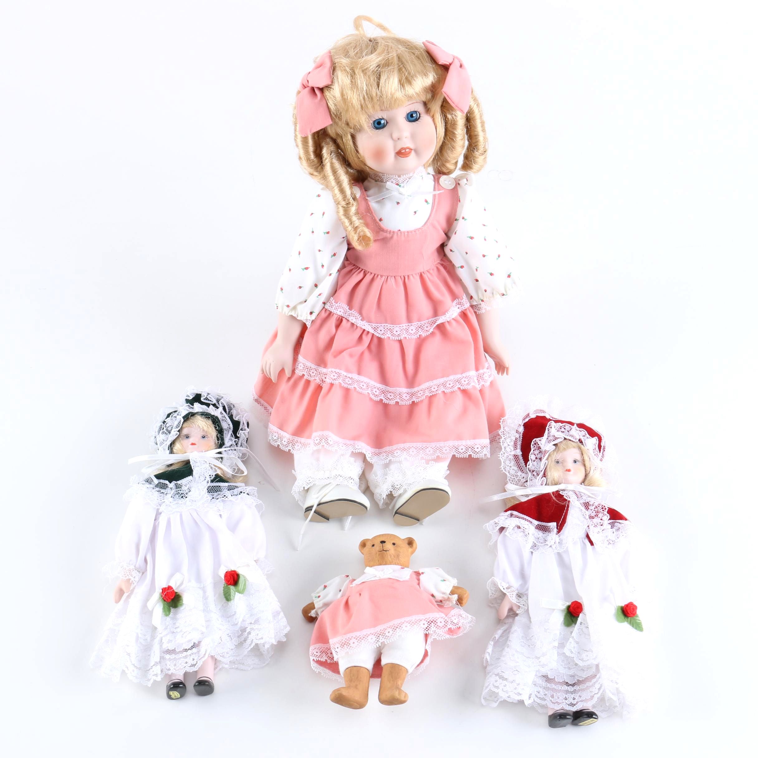 Porcelain Dolls Including a Dynasty Doll with Matching Bear