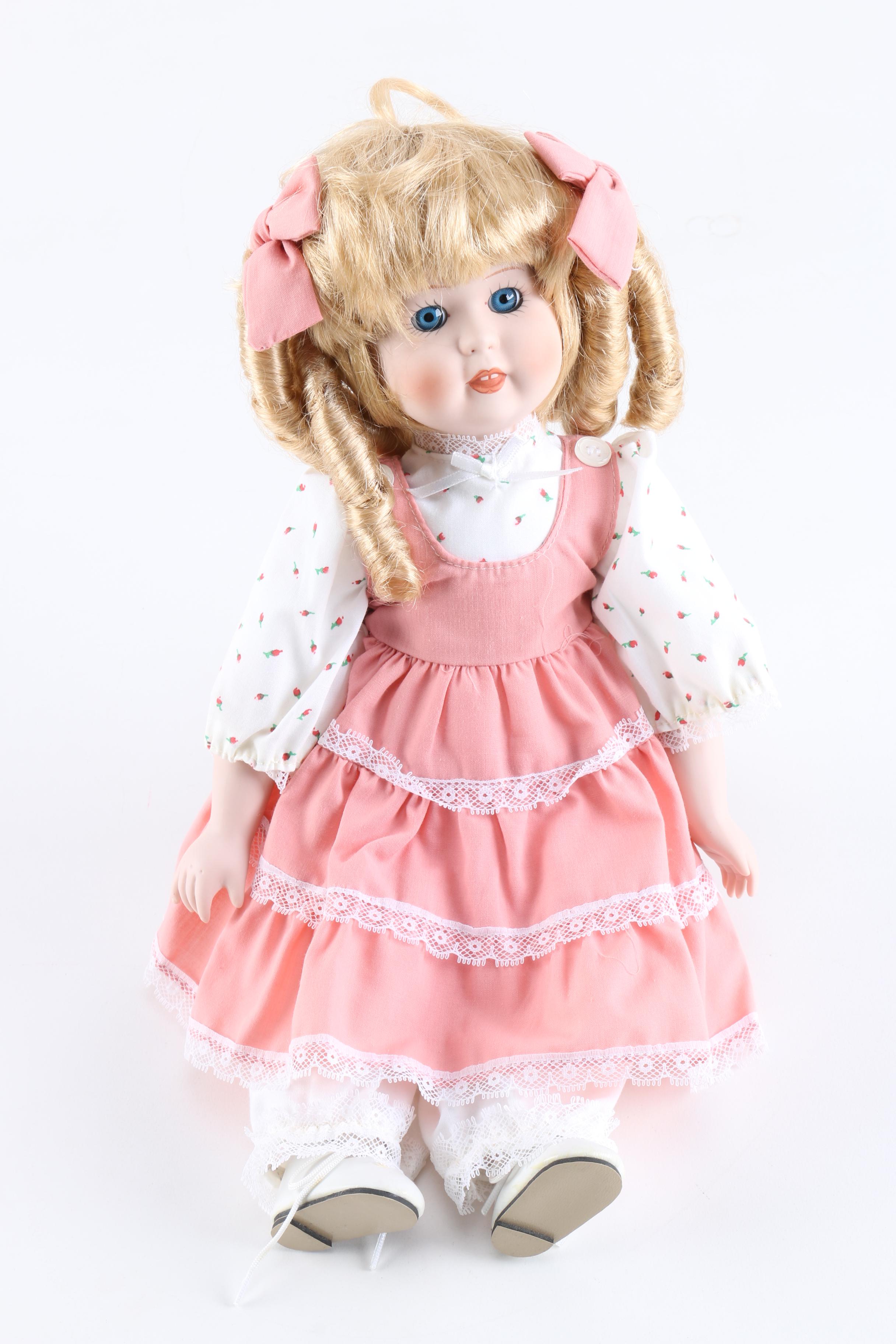 Porcelain Dolls Including a Dynasty Doll with Matching Bear