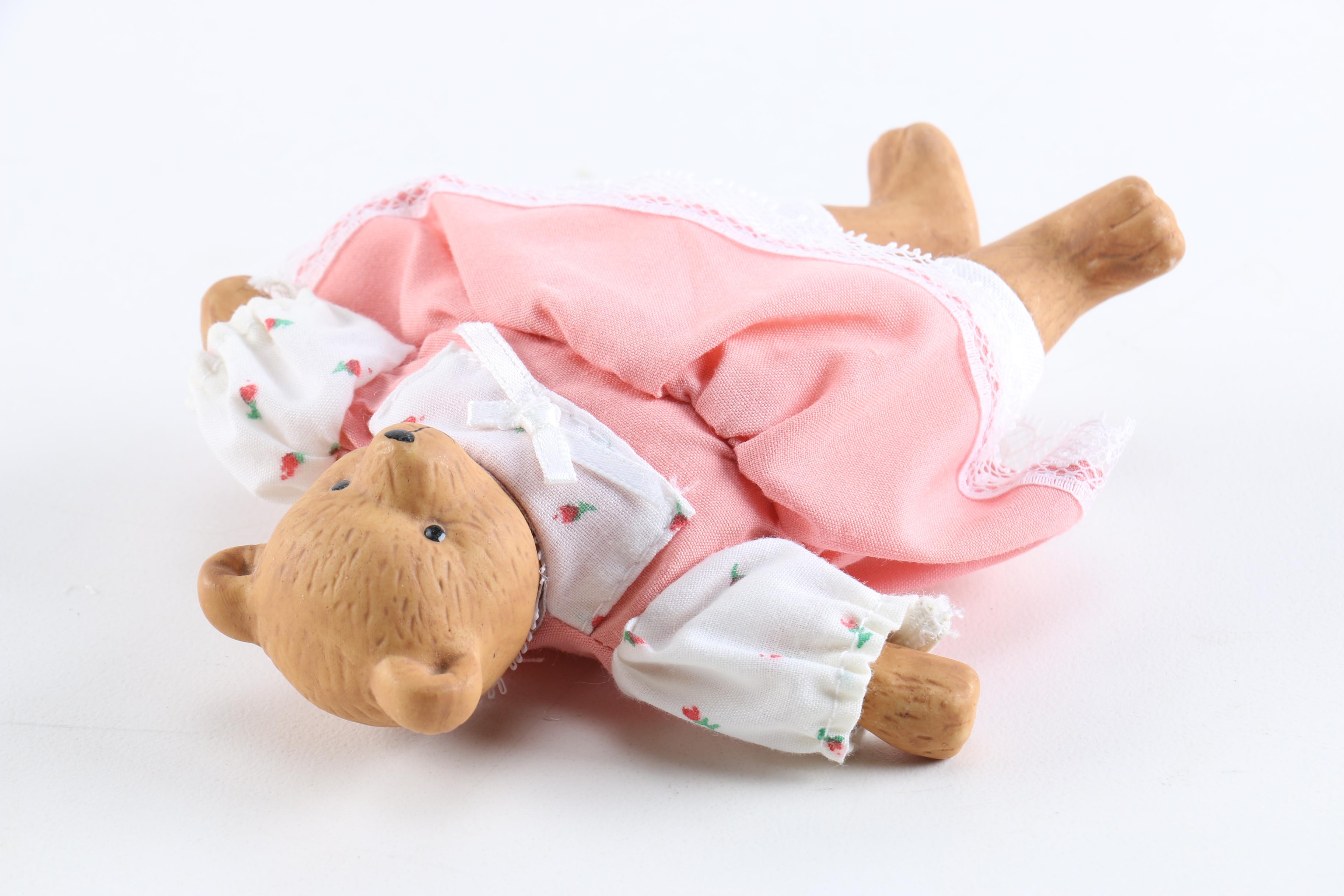 Porcelain Dolls Including a Dynasty Doll with Matching Bear