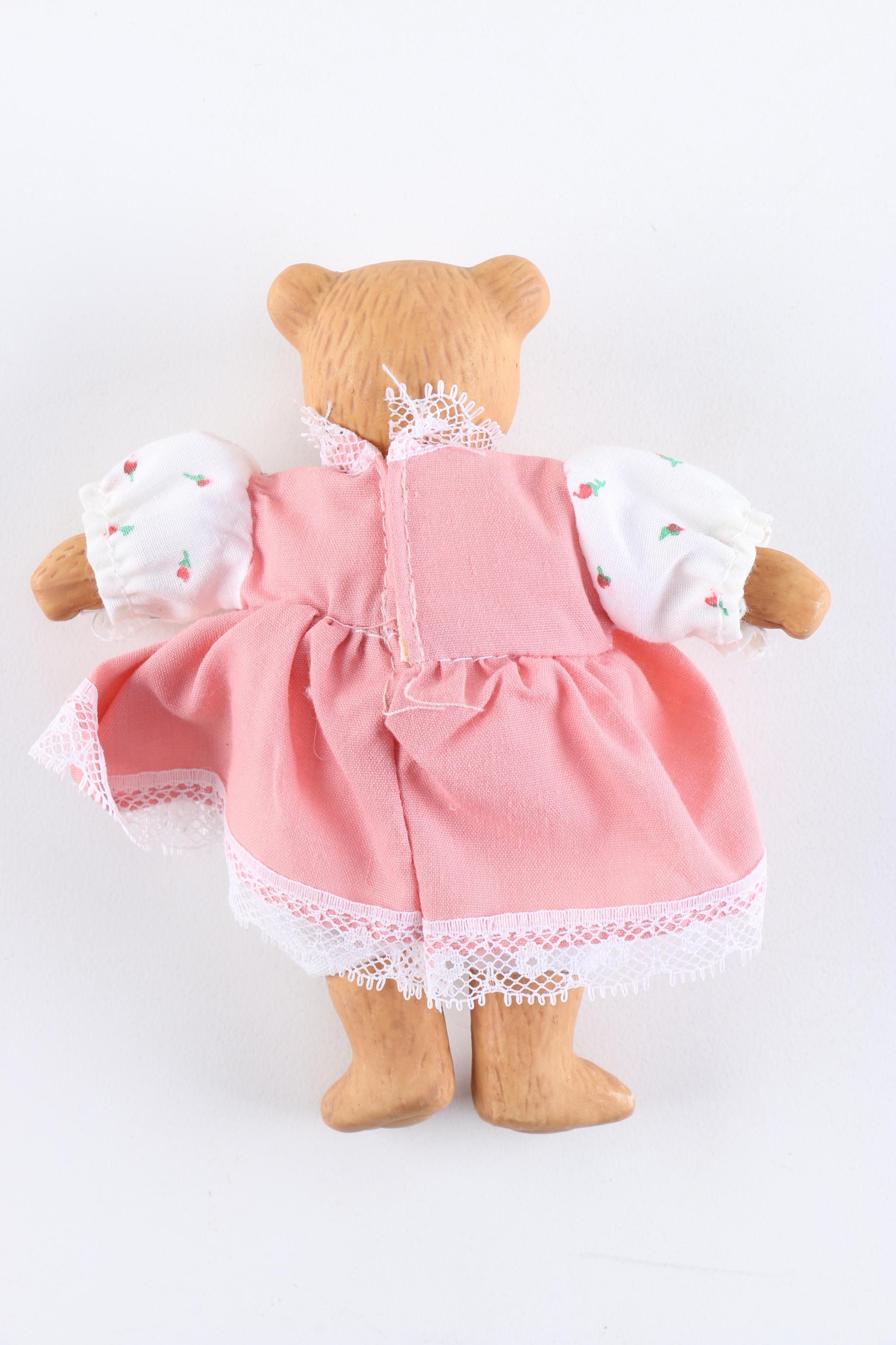 Porcelain Dolls Including a Dynasty Doll with Matching Bear