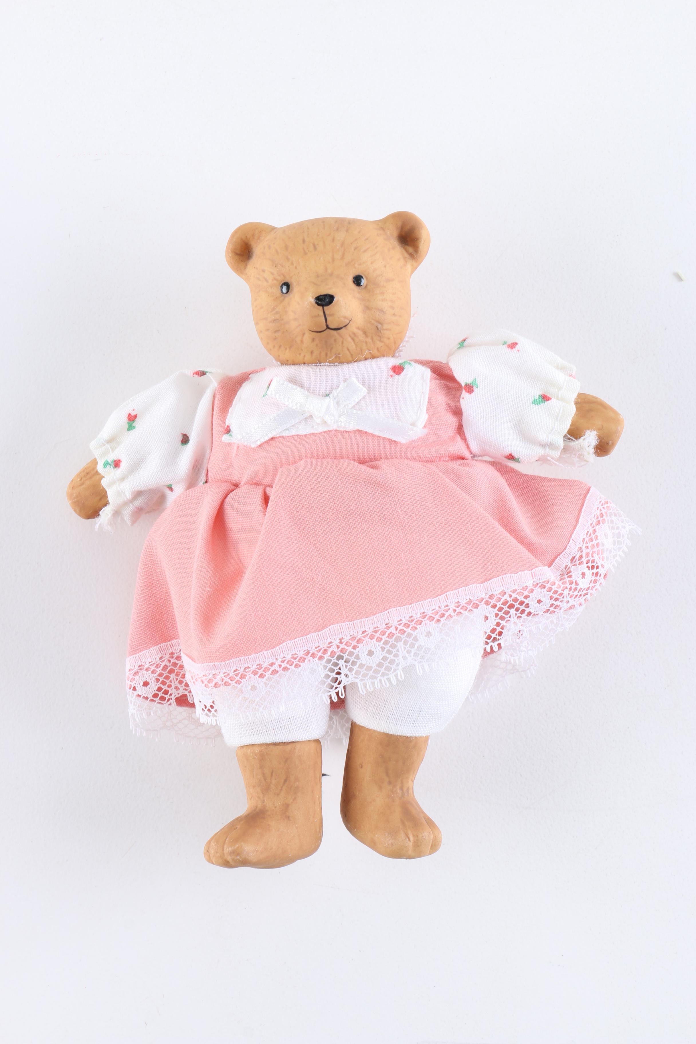 Porcelain Dolls Including a Dynasty Doll with Matching Bear