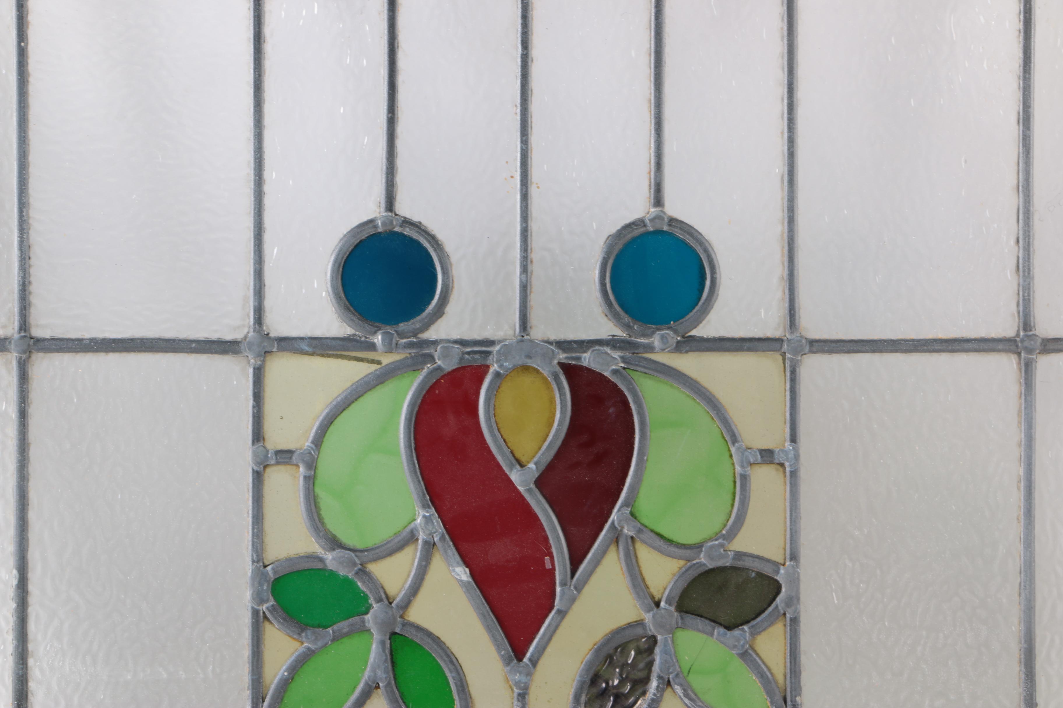 Stained Glass Window in White Wood Frame