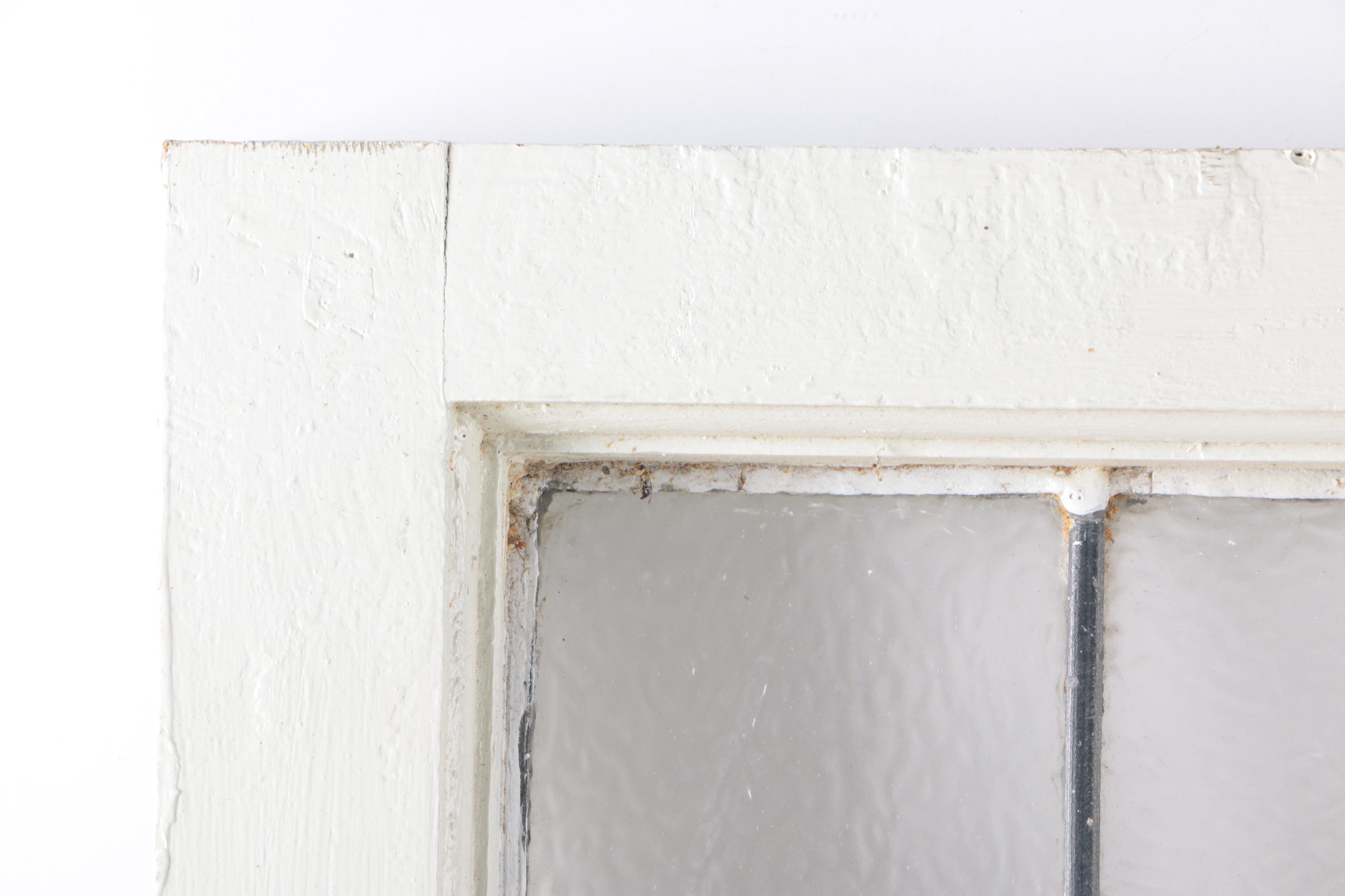 Stained Glass Window in White Wood Frame