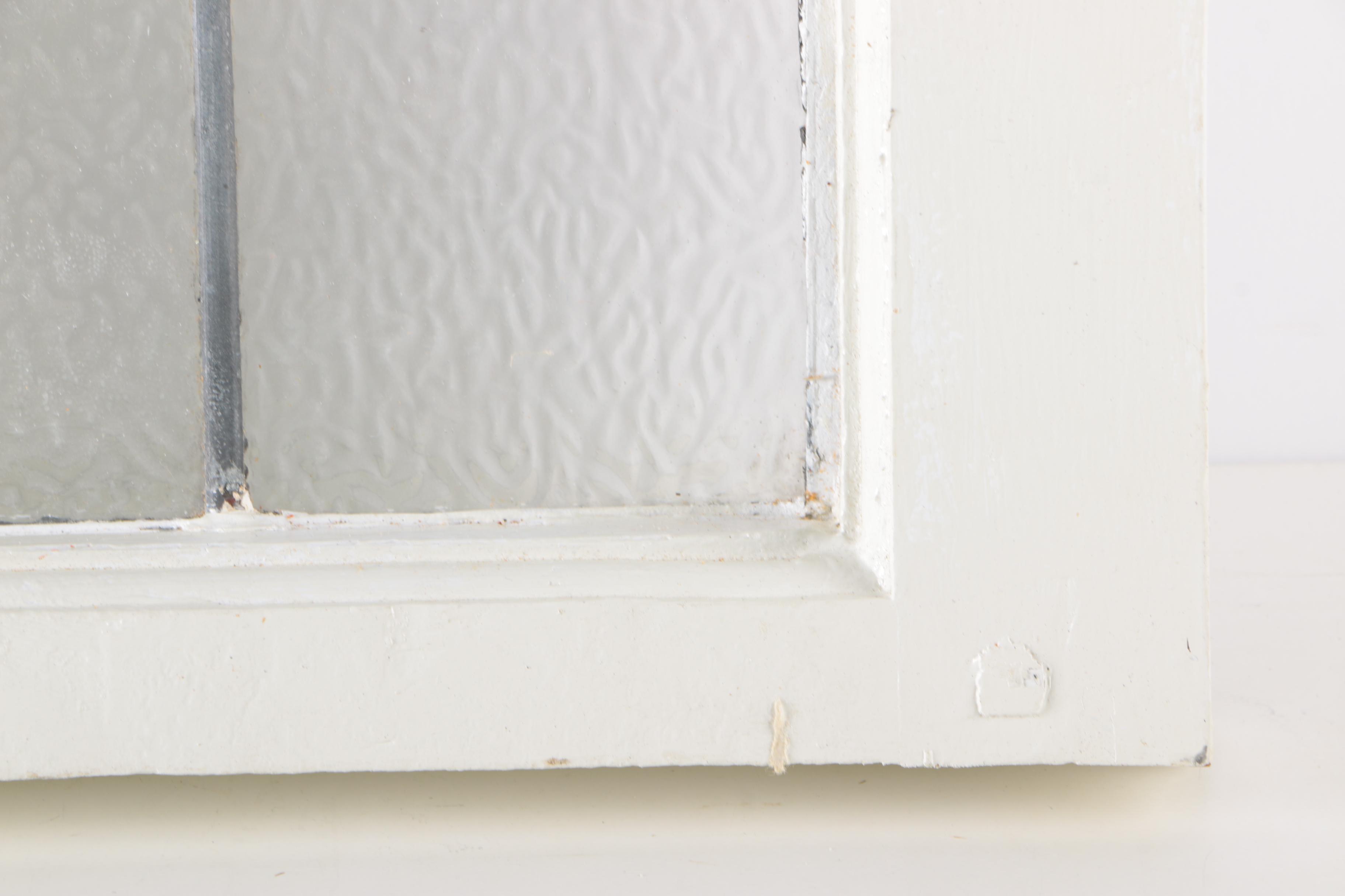 Stained Glass Window in White Wood Frame