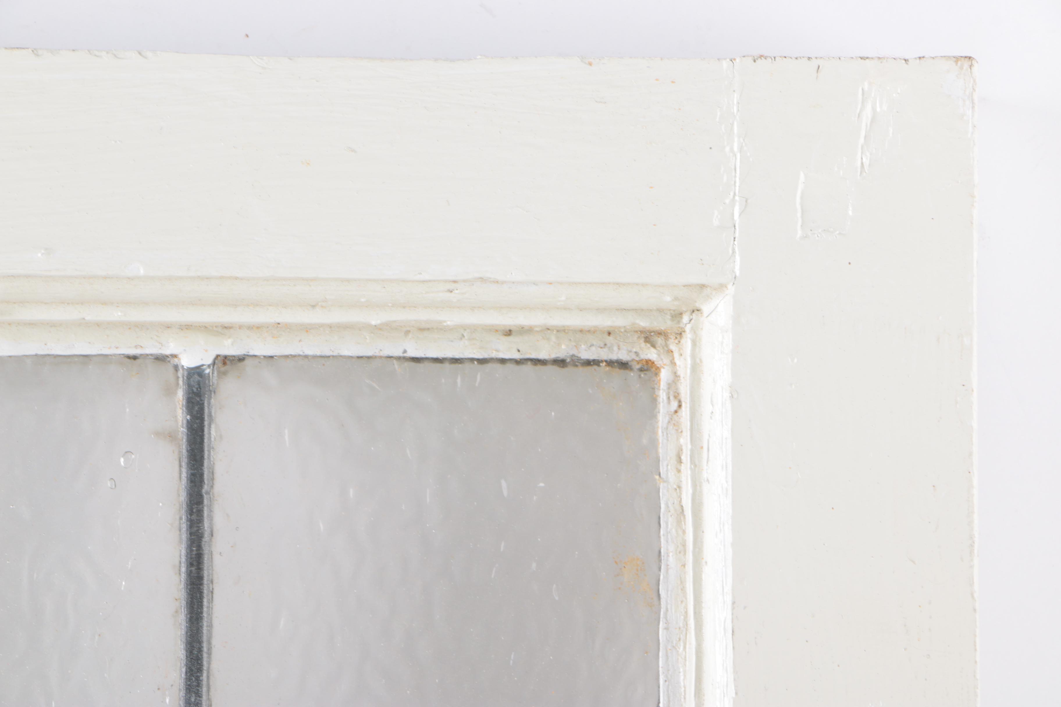 Stained Glass Window in White Wood Frame