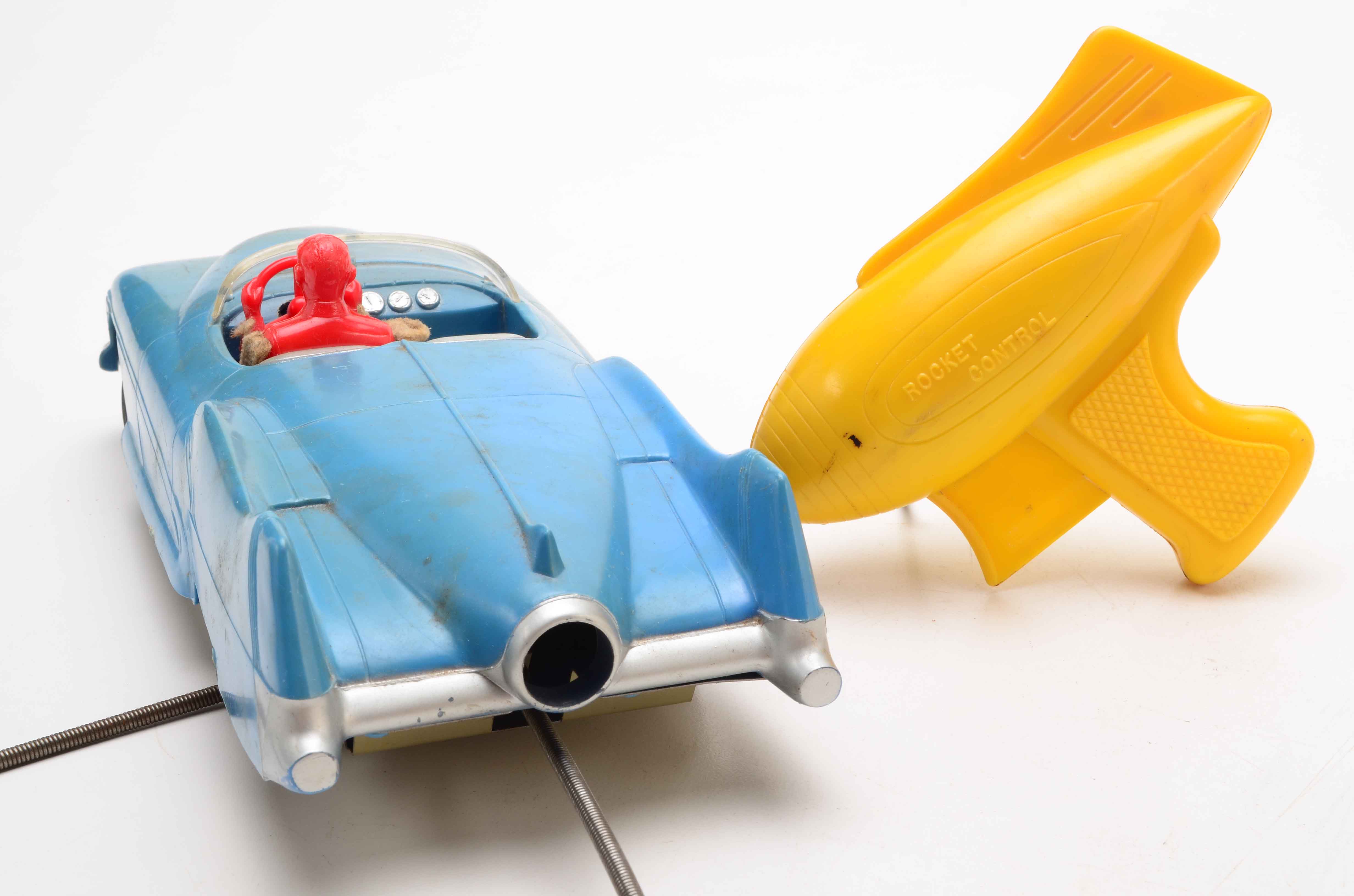 Vintage Blue Car with Yellow Rocket