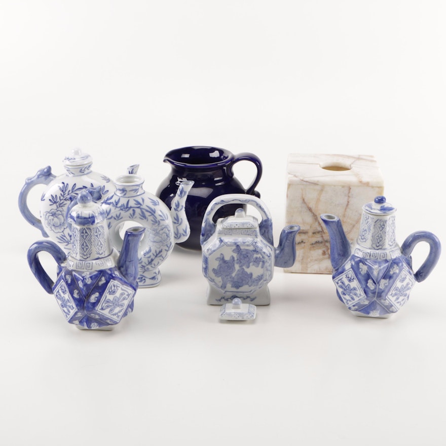 Assortment of Seven Decorative Objects Including Blue and White Teapots