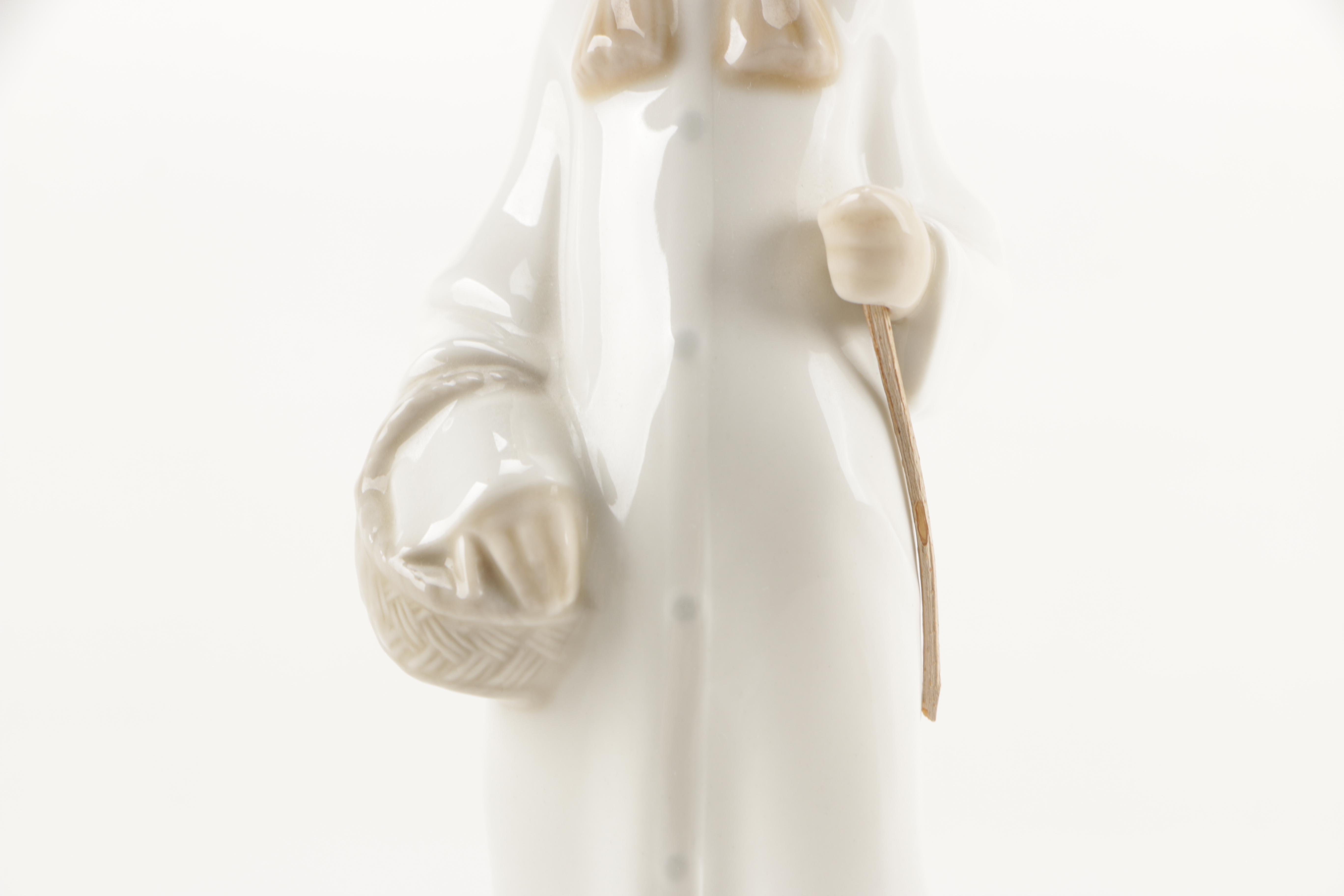 Two Lladró "Shepherd Girl with Basket" Porcelain Figurines