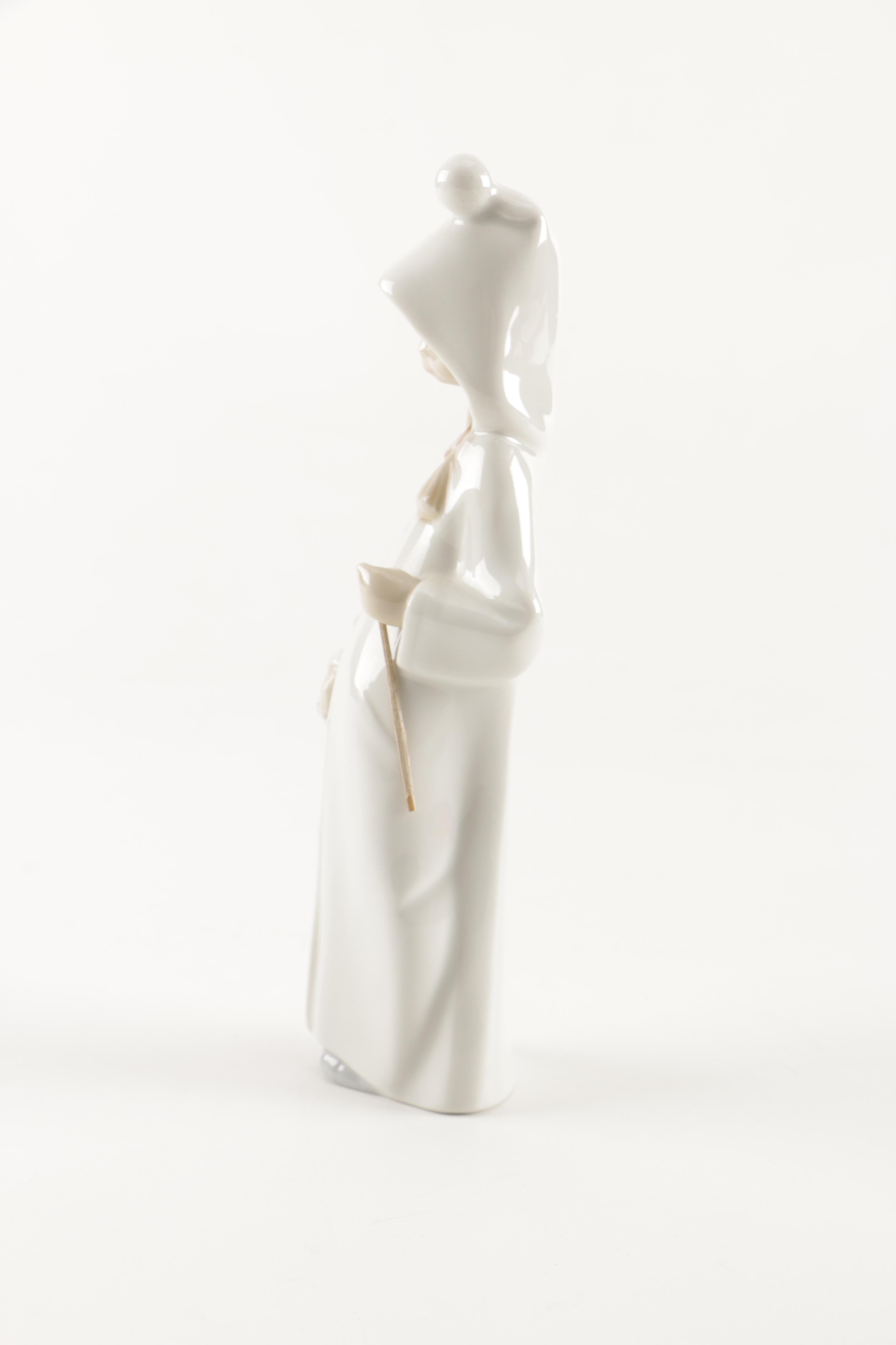 Two Lladró "Shepherd Girl with Basket" Porcelain Figurines