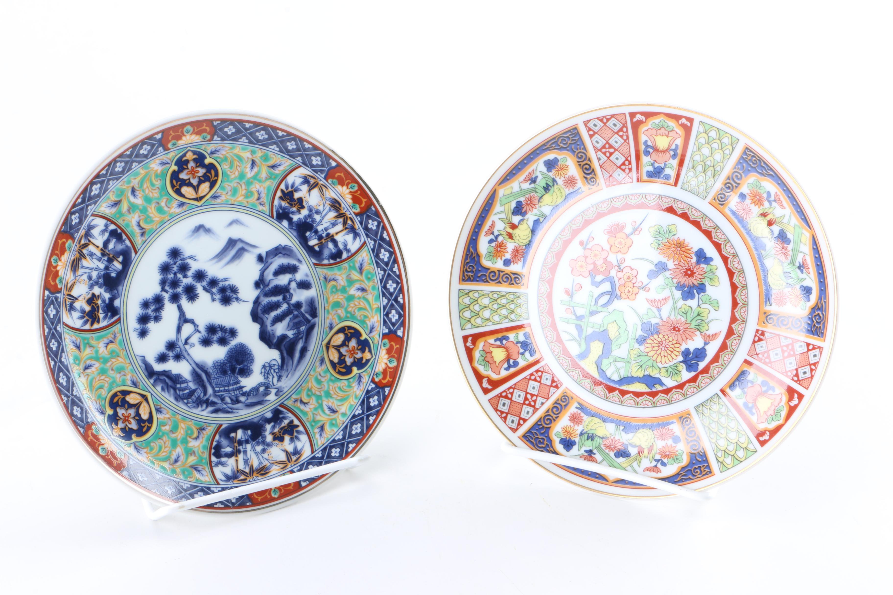 Assortment of Asian Themed Plates and Stands
