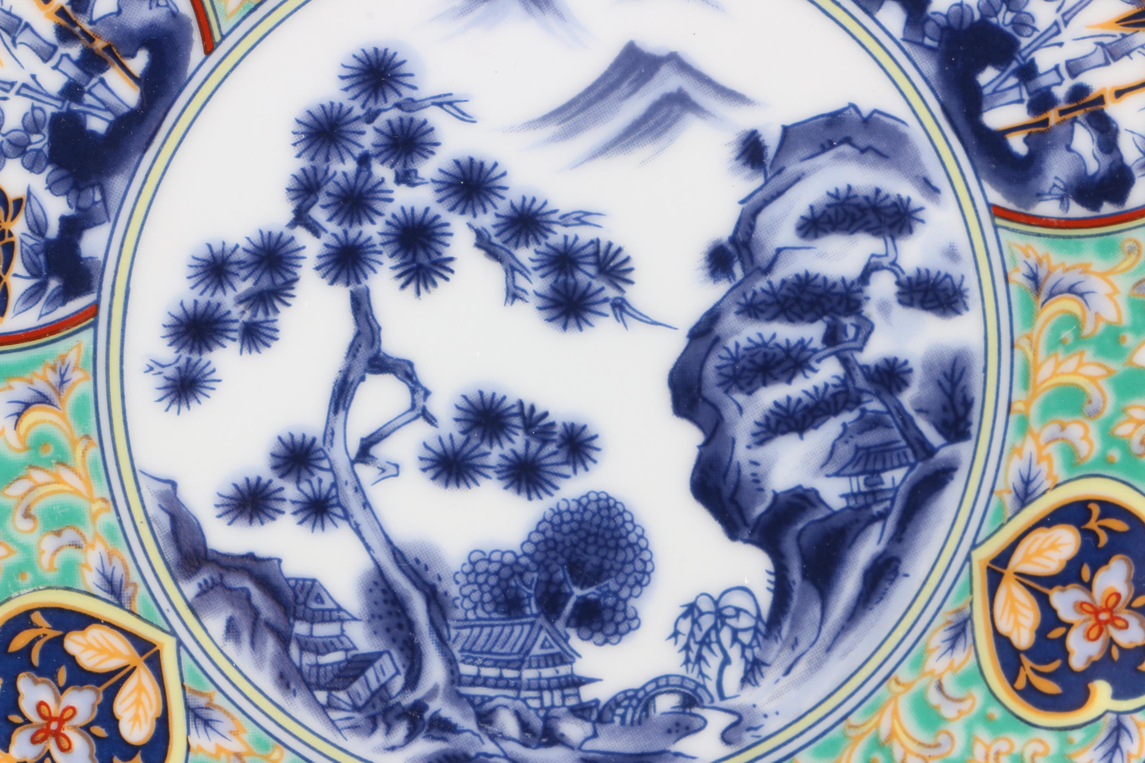 Assortment of Asian Themed Plates and Stands