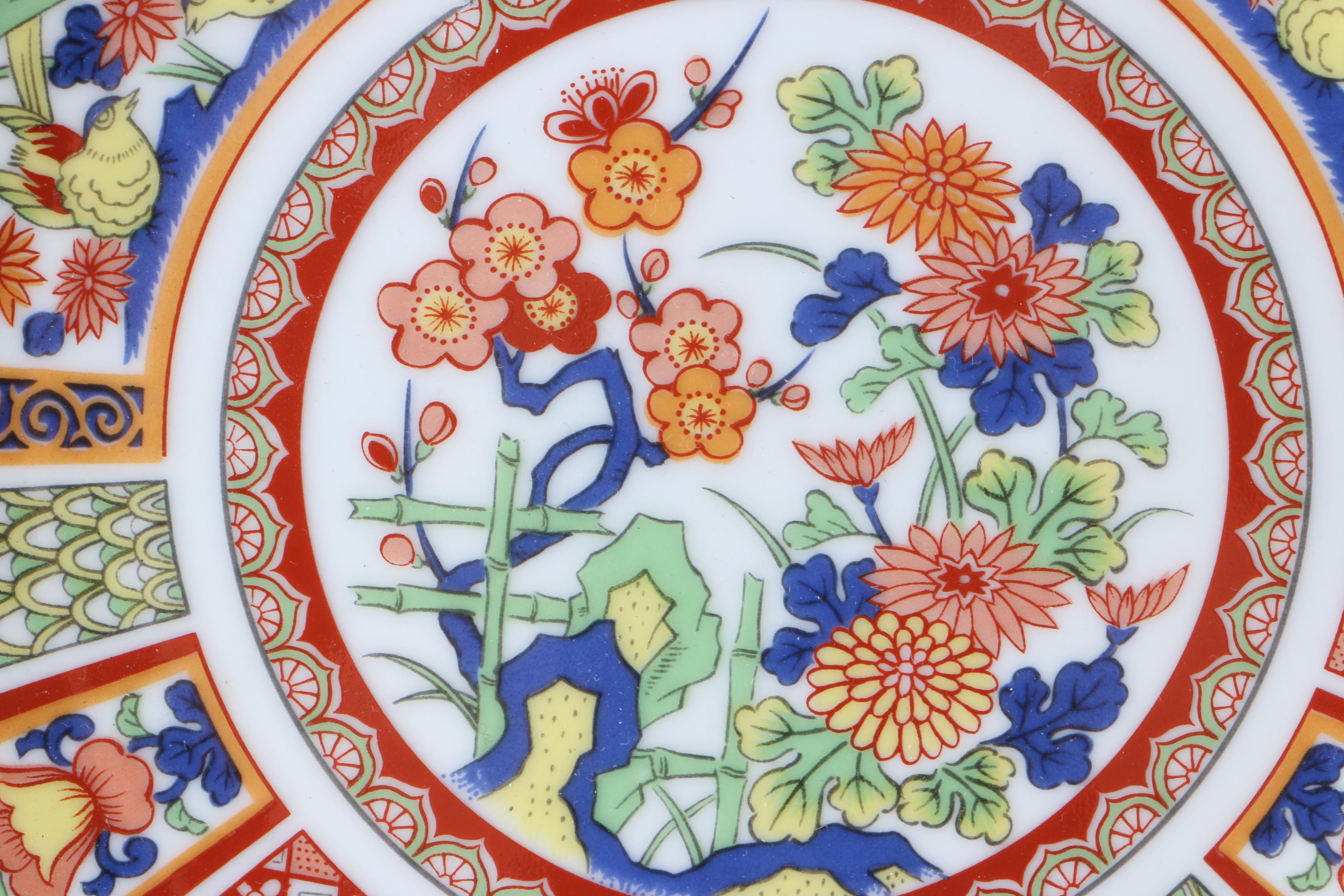 Assortment of Asian Themed Plates and Stands