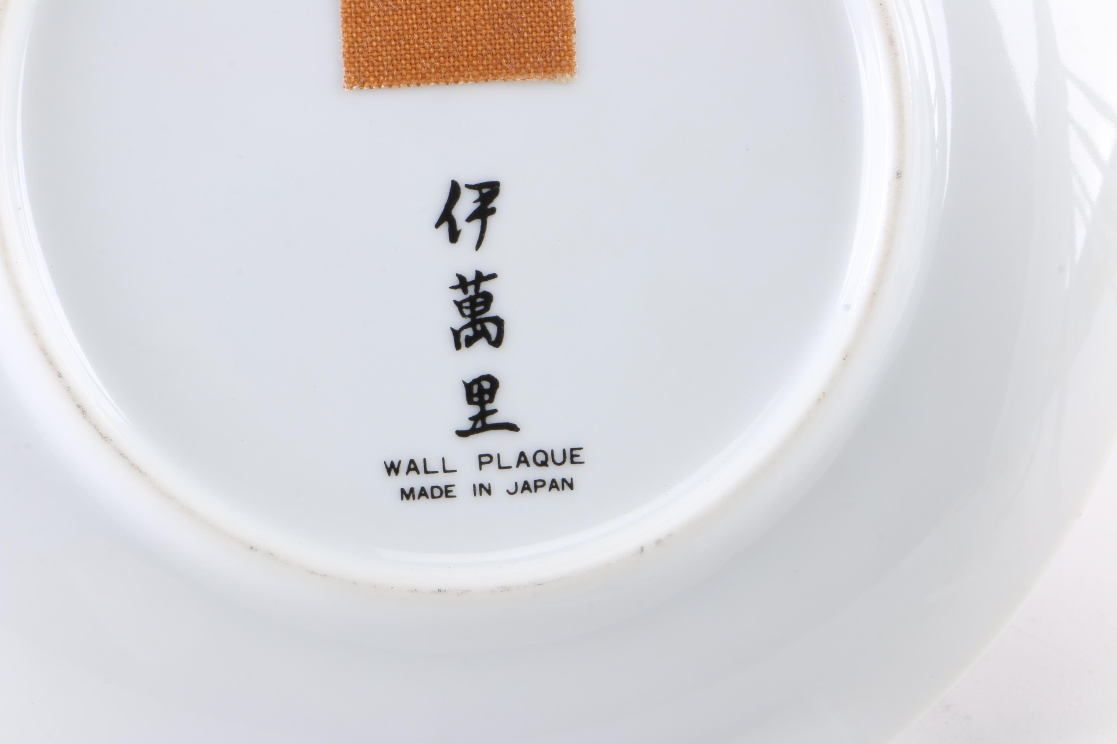 Assortment of Asian Themed Plates and Stands