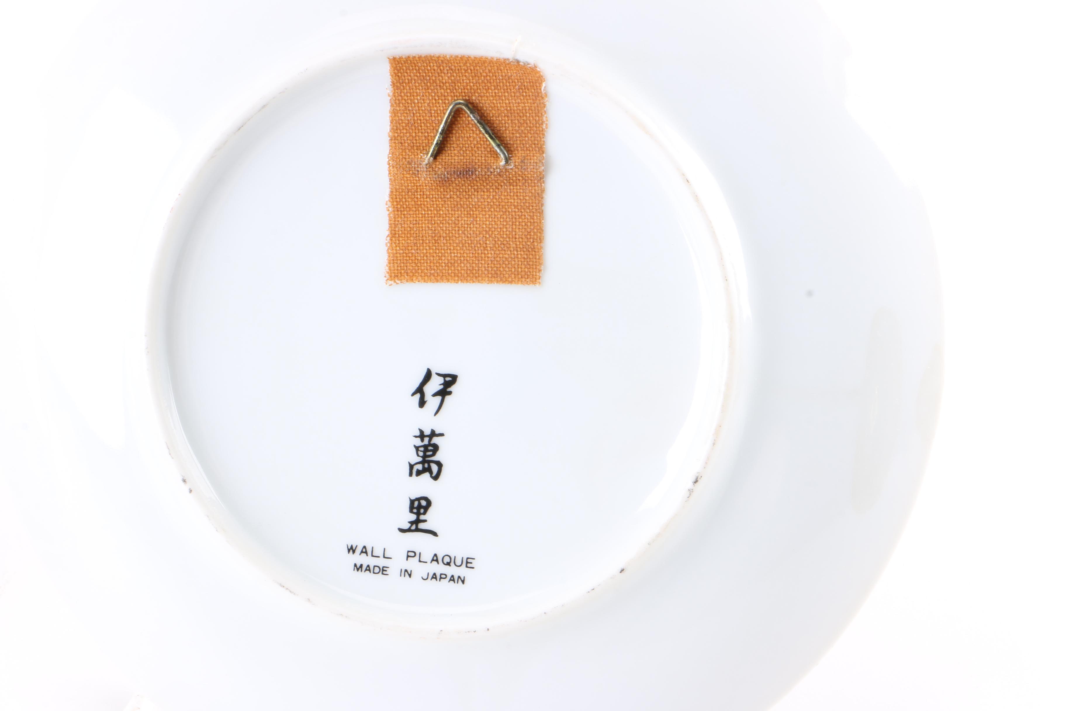 Assortment of Asian Themed Plates and Stands